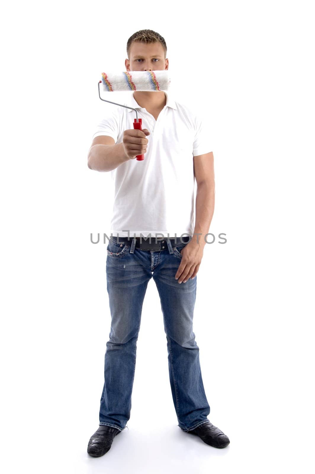 young guy holding painting brush on an isolated white background