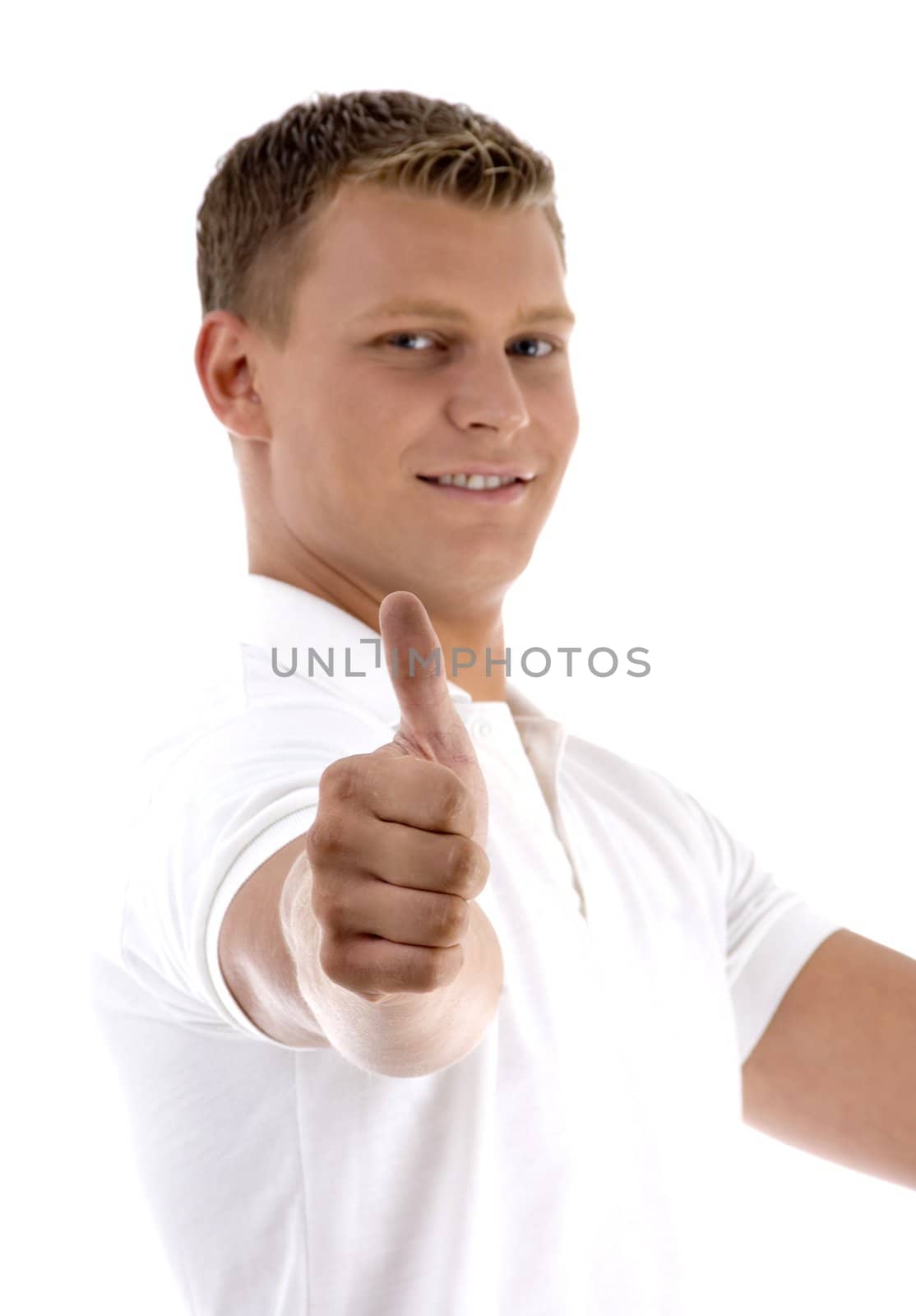 portrait of young guy gesturing thumbs up  with white background