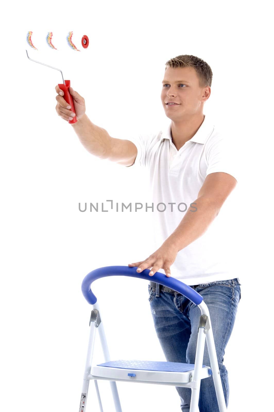 young guy holding painting brush on an isolated white background