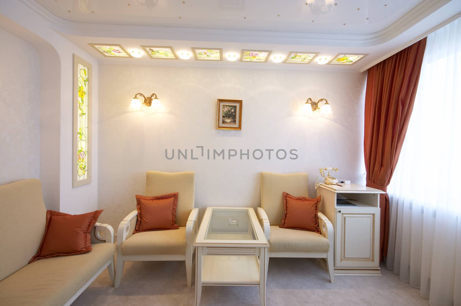 interior of room with armchair, table and  bedside-table