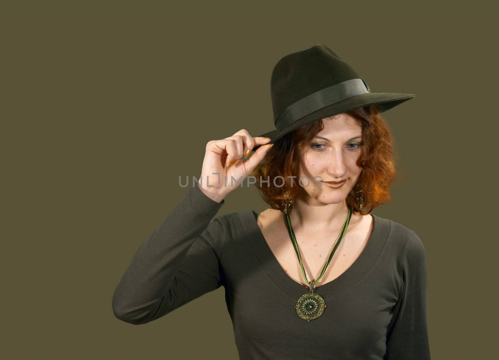 Red haired girl in a hat