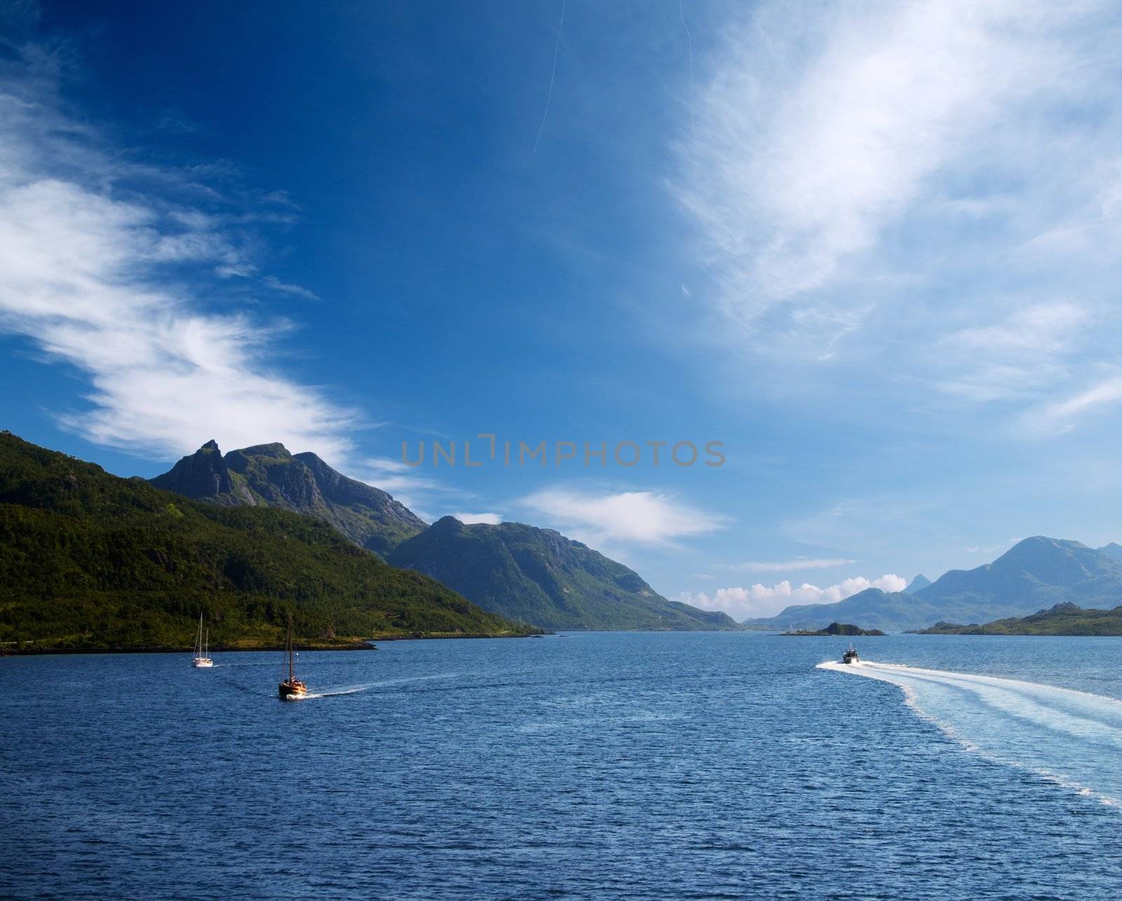 ships in norway fiord near lofoten islands