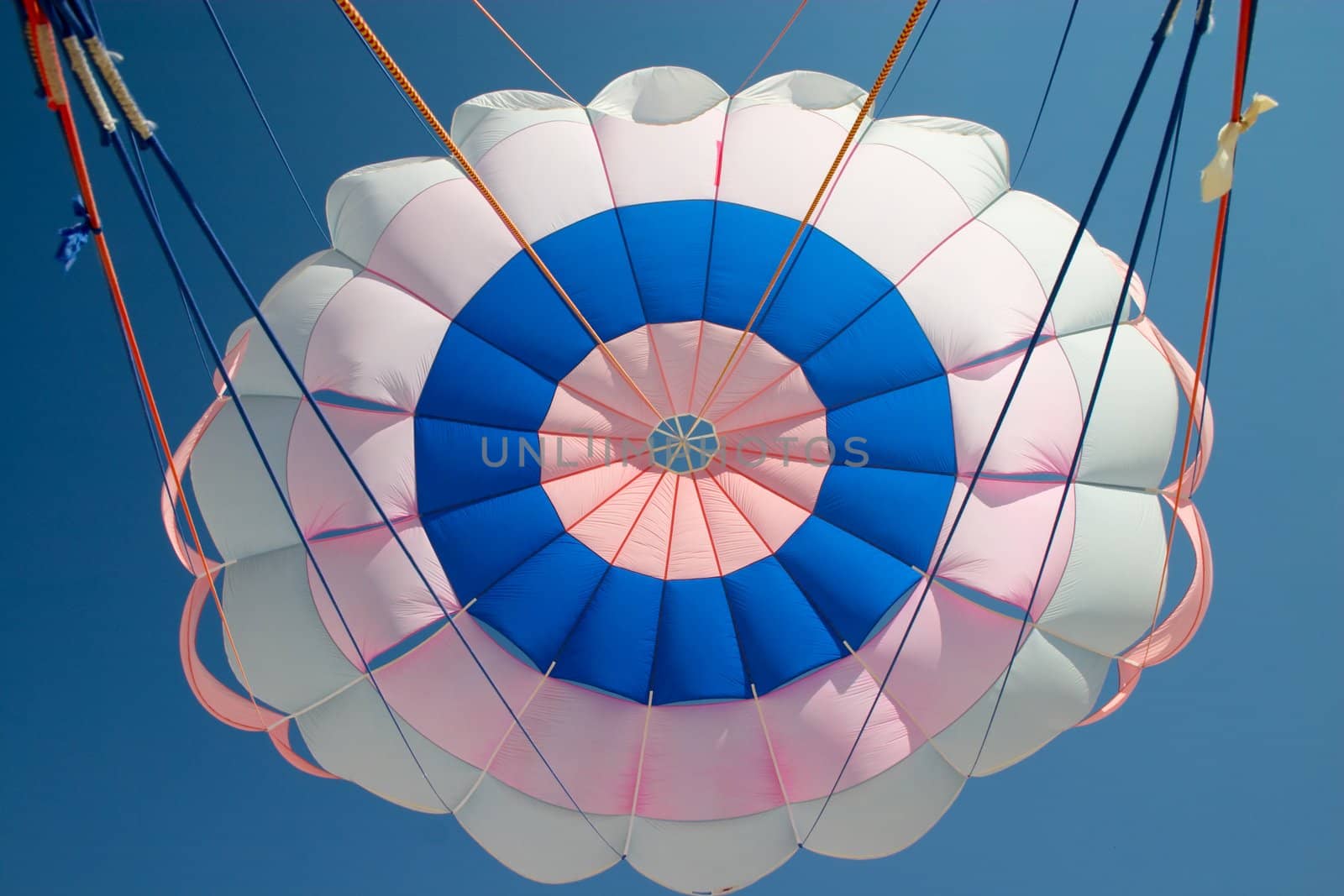 colorful parachute on the background of blue sky