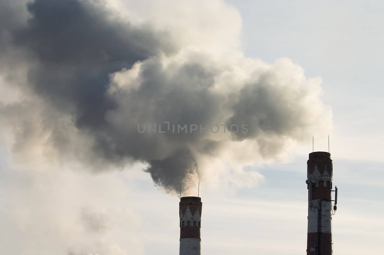 Factory chimney with gas puffs