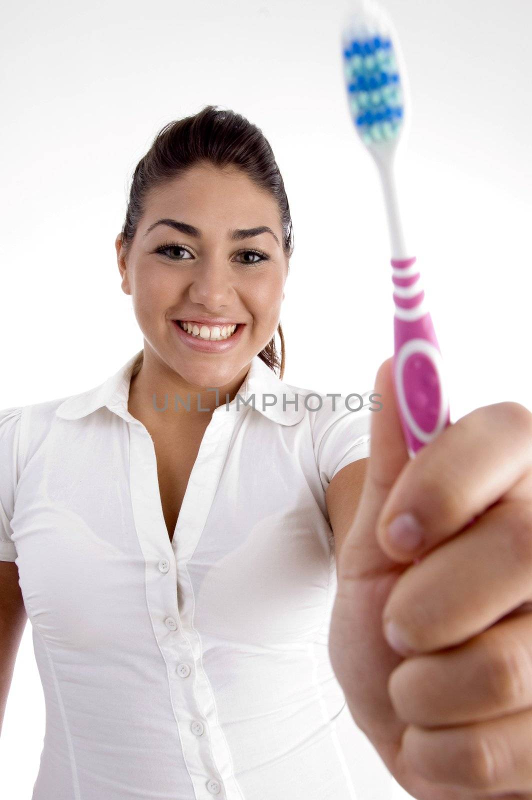 beautiful woman showing her toothbrush with white background