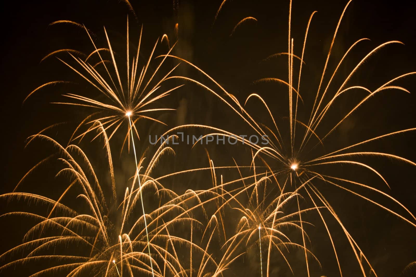 Yellow fireworks display in black sky