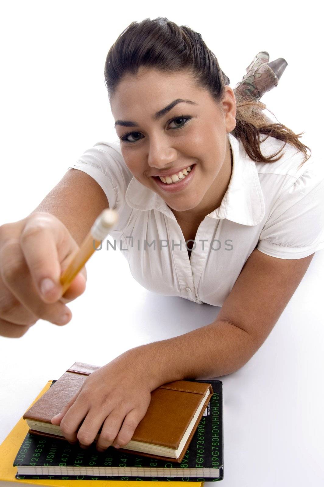 college girl lying with her notebooks on an isolated white background