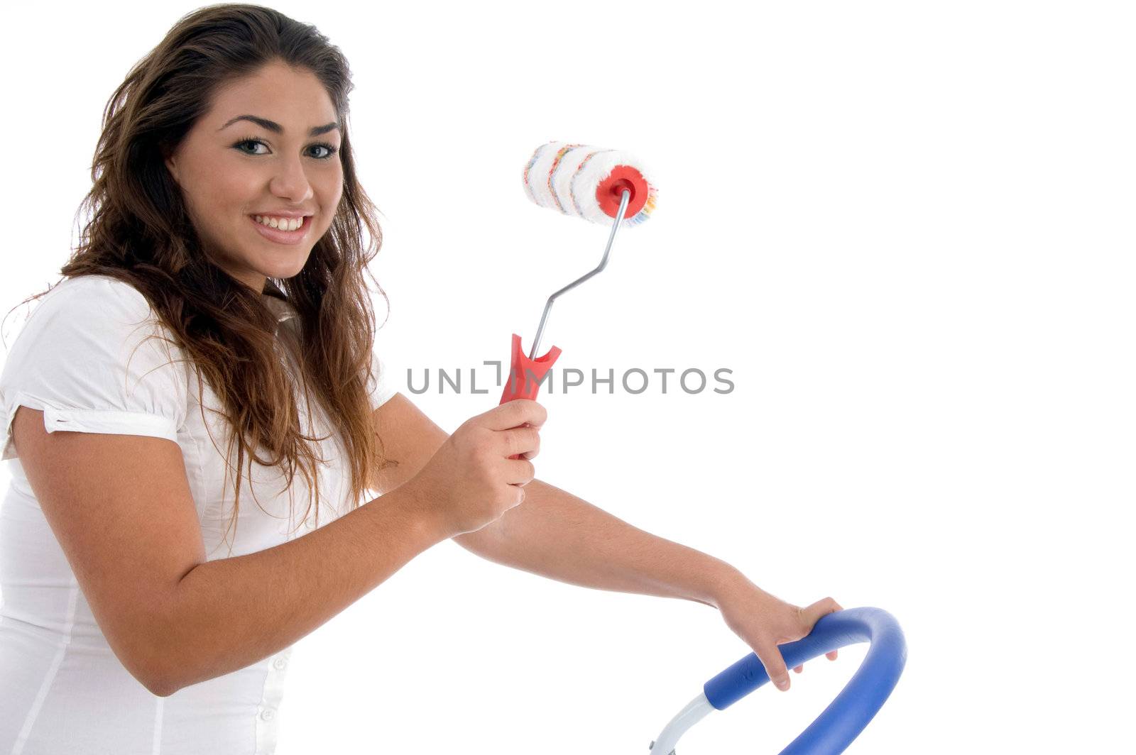 young girl holding rolling brush on an isolated white background