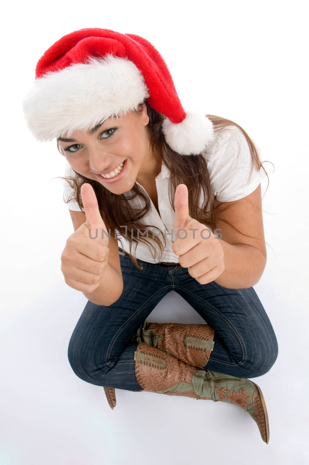 beautiful female wearing christmas hat against white background