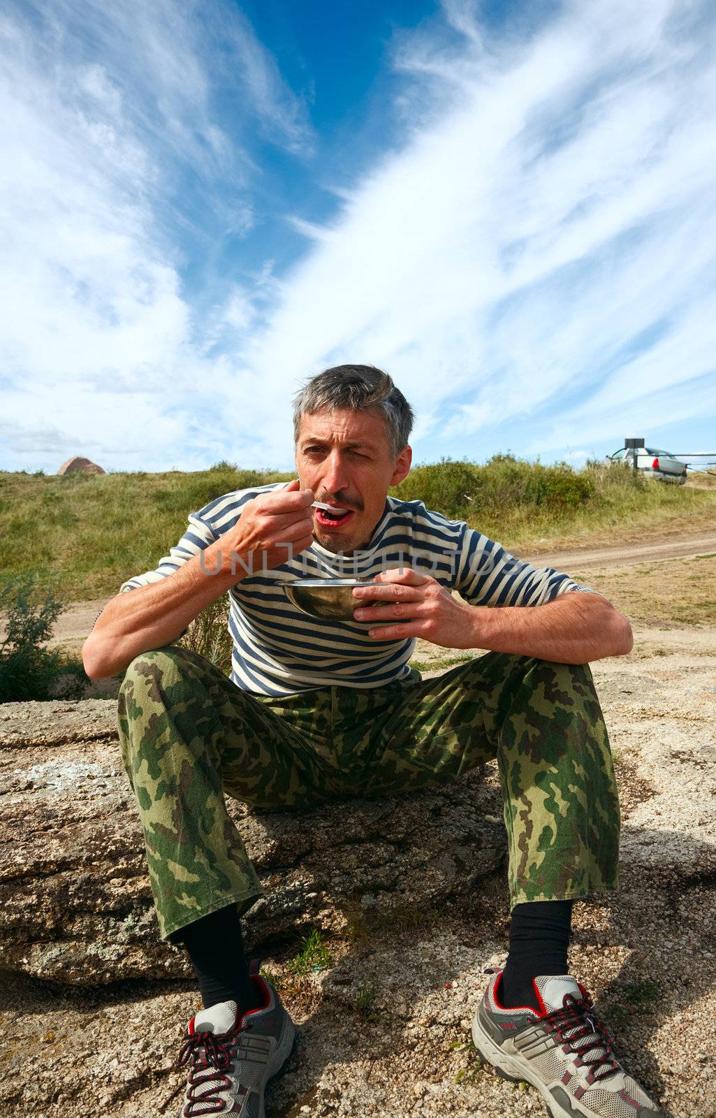 Man eat mush on the nature