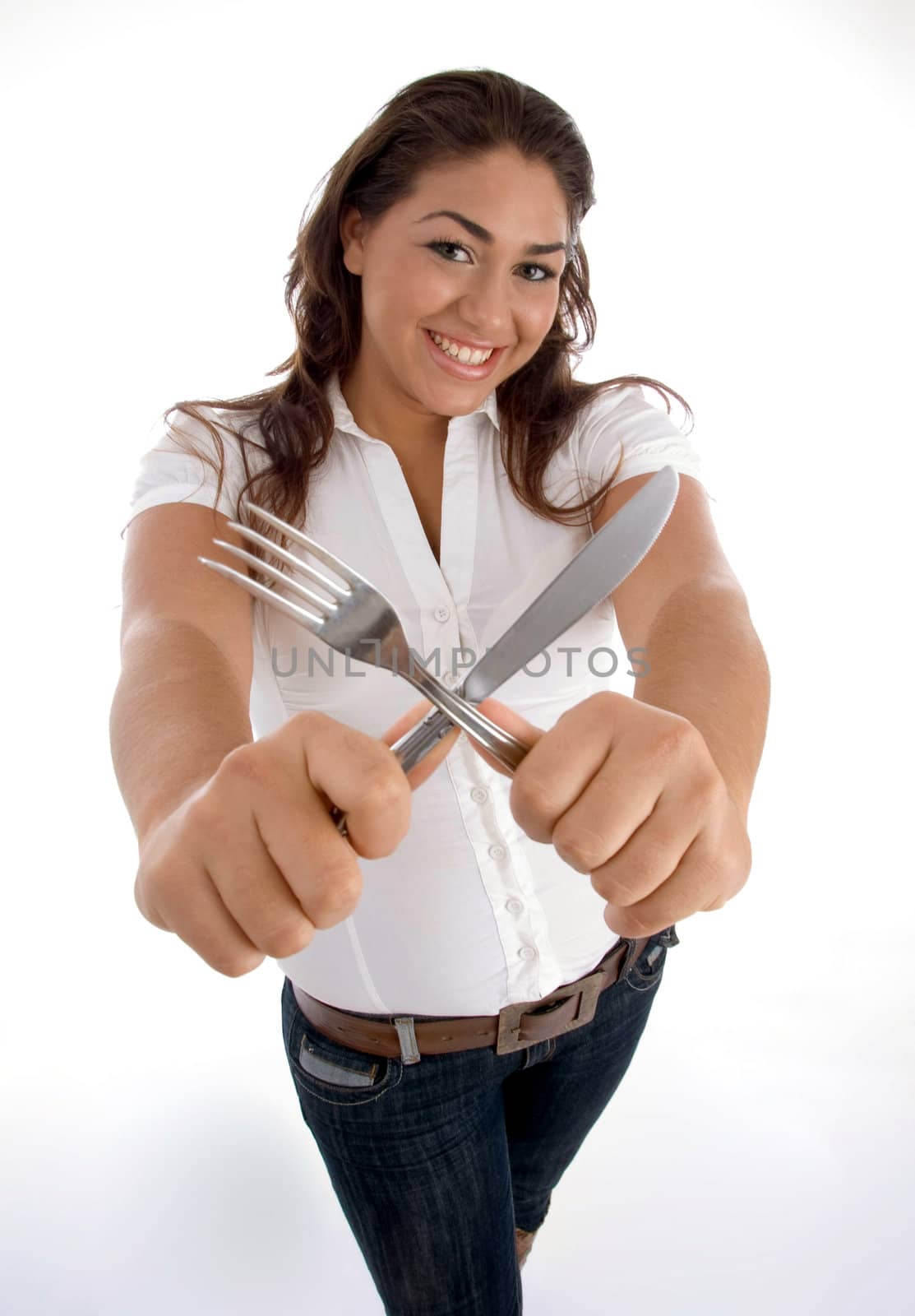 cute teenager showing cutlery on an isolated white background