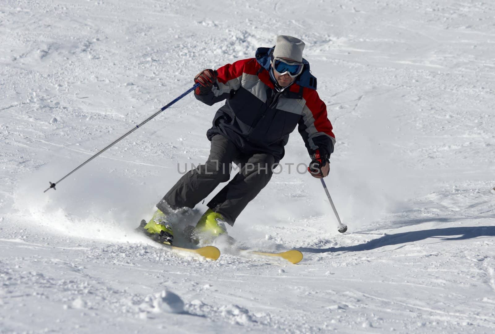 skier moving down on the snow slope