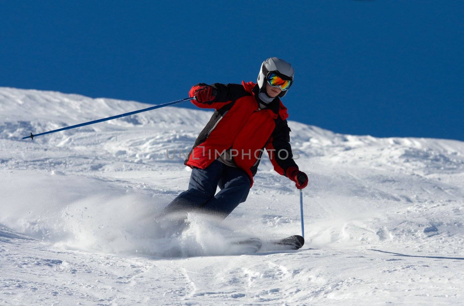 Skier in helmet rush at full speed