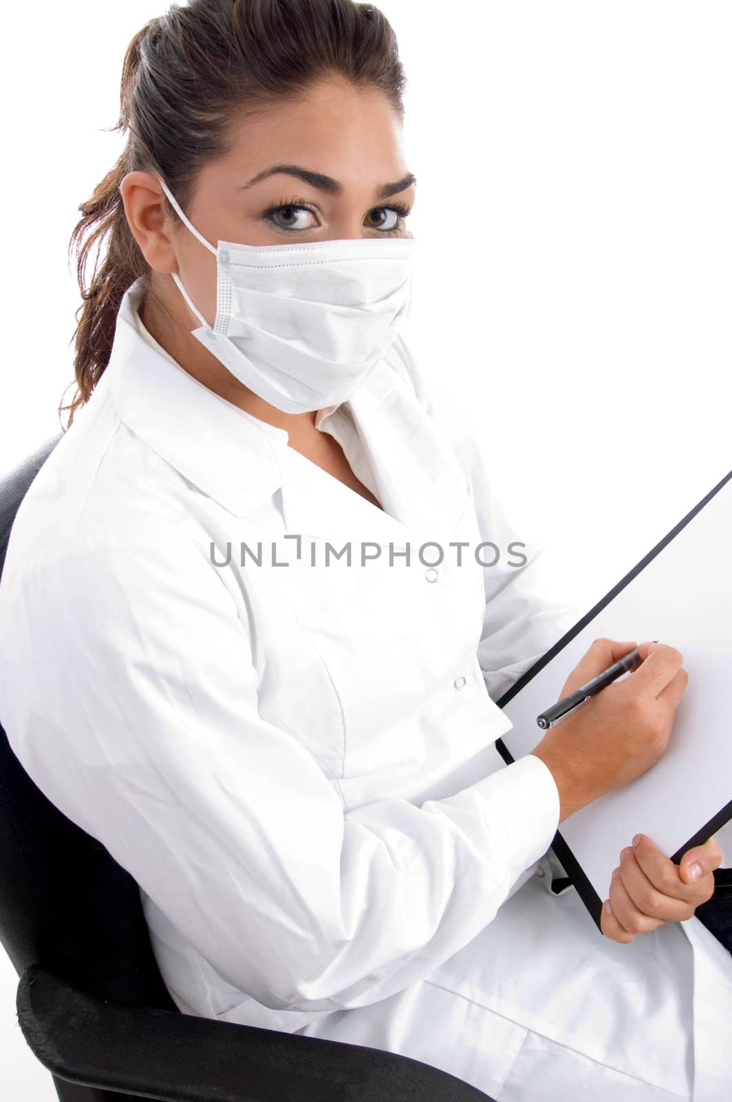 sitting doctor with mask on her mouth and writing board against white background