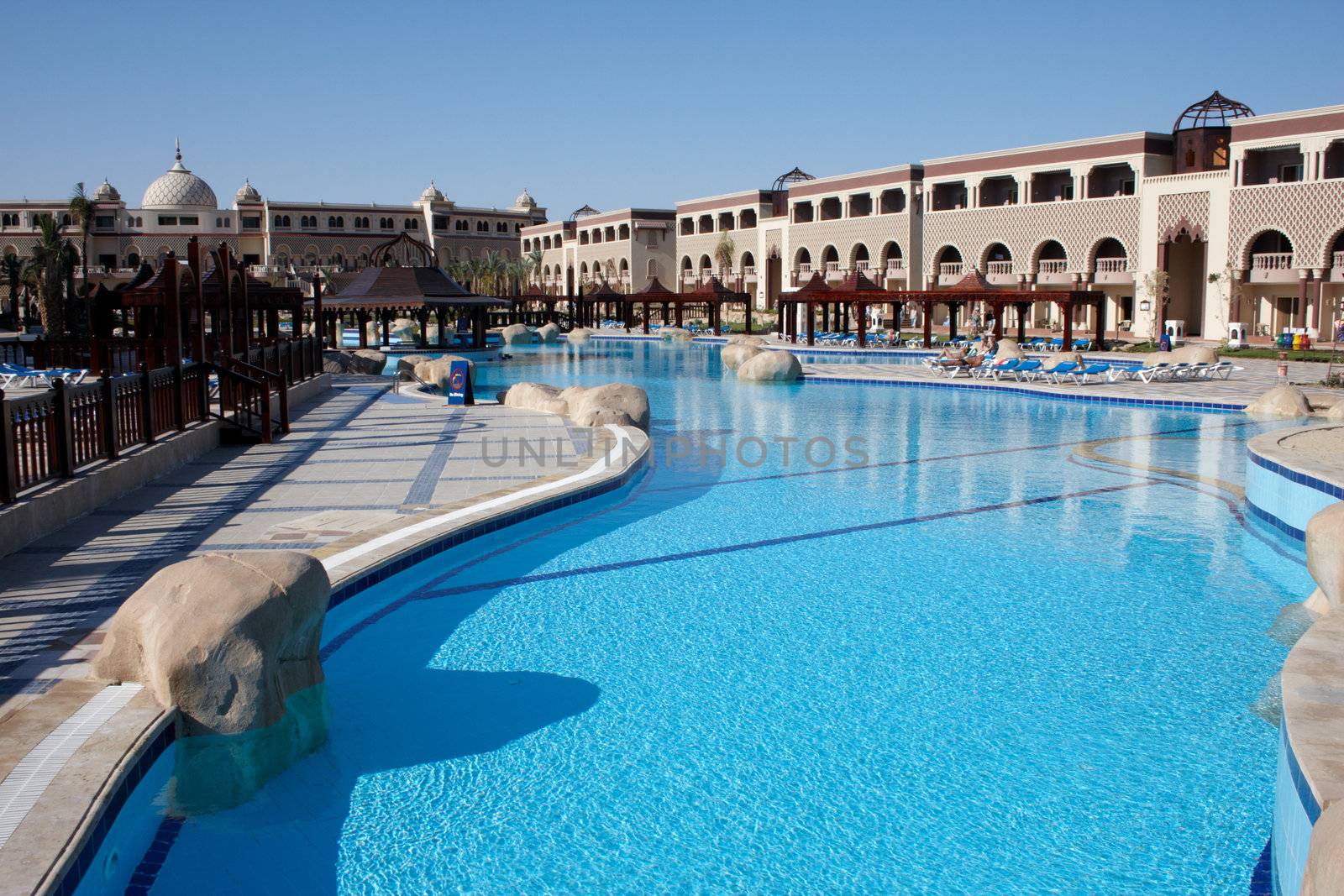 swimming pool with bright blue water in oriental resort