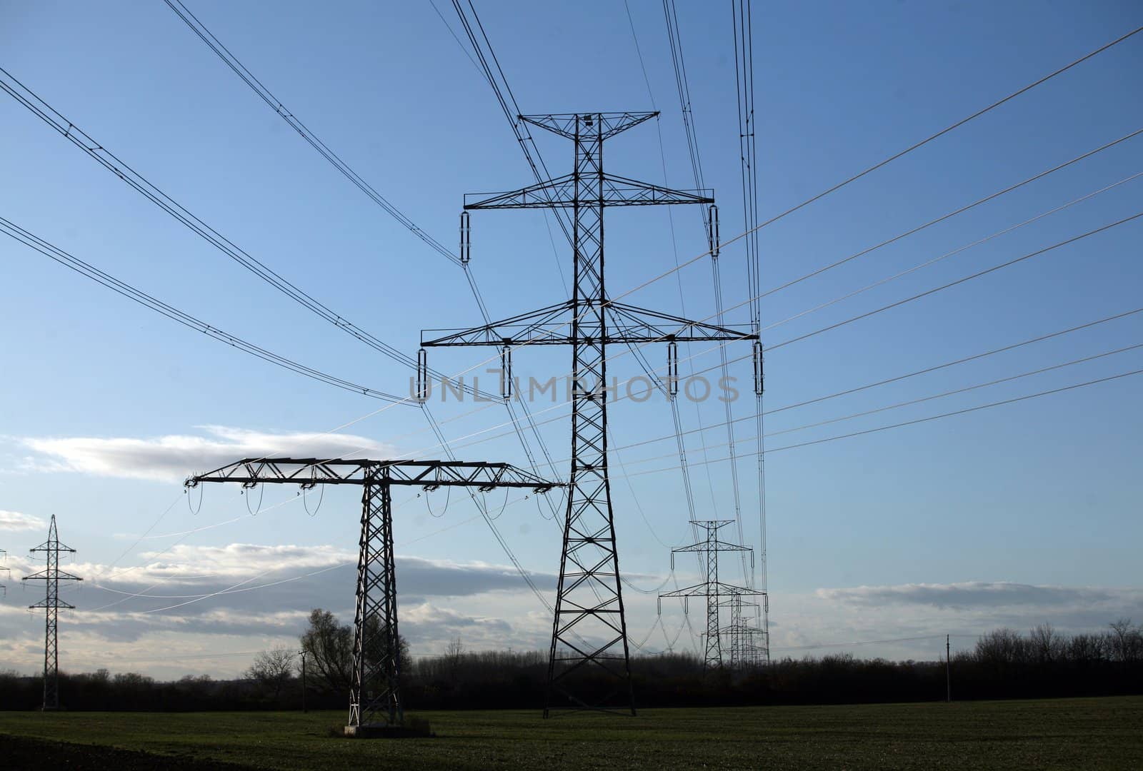 Electric pylons in field