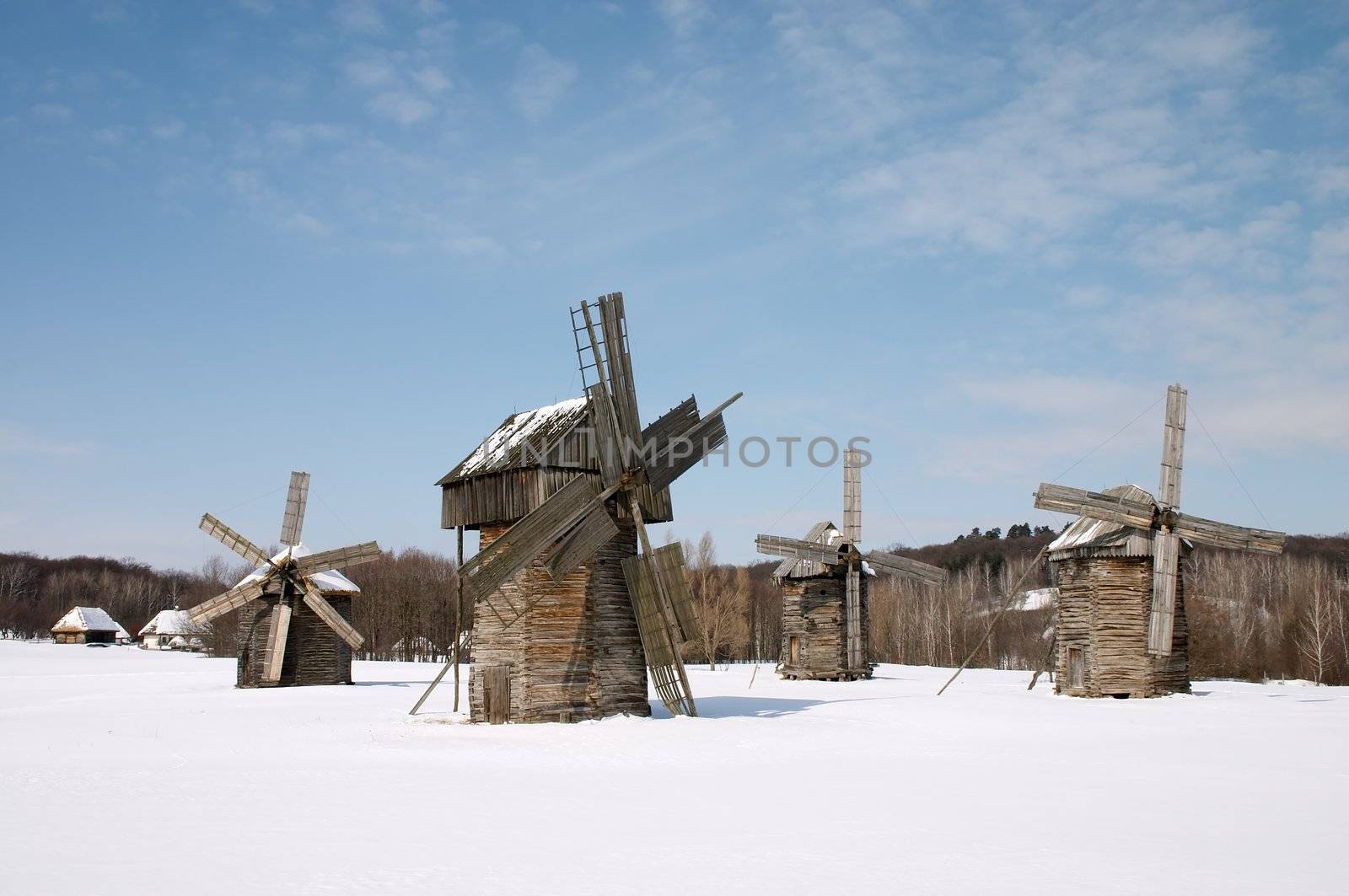 Windmills in the winter countryside scenic under blue sky