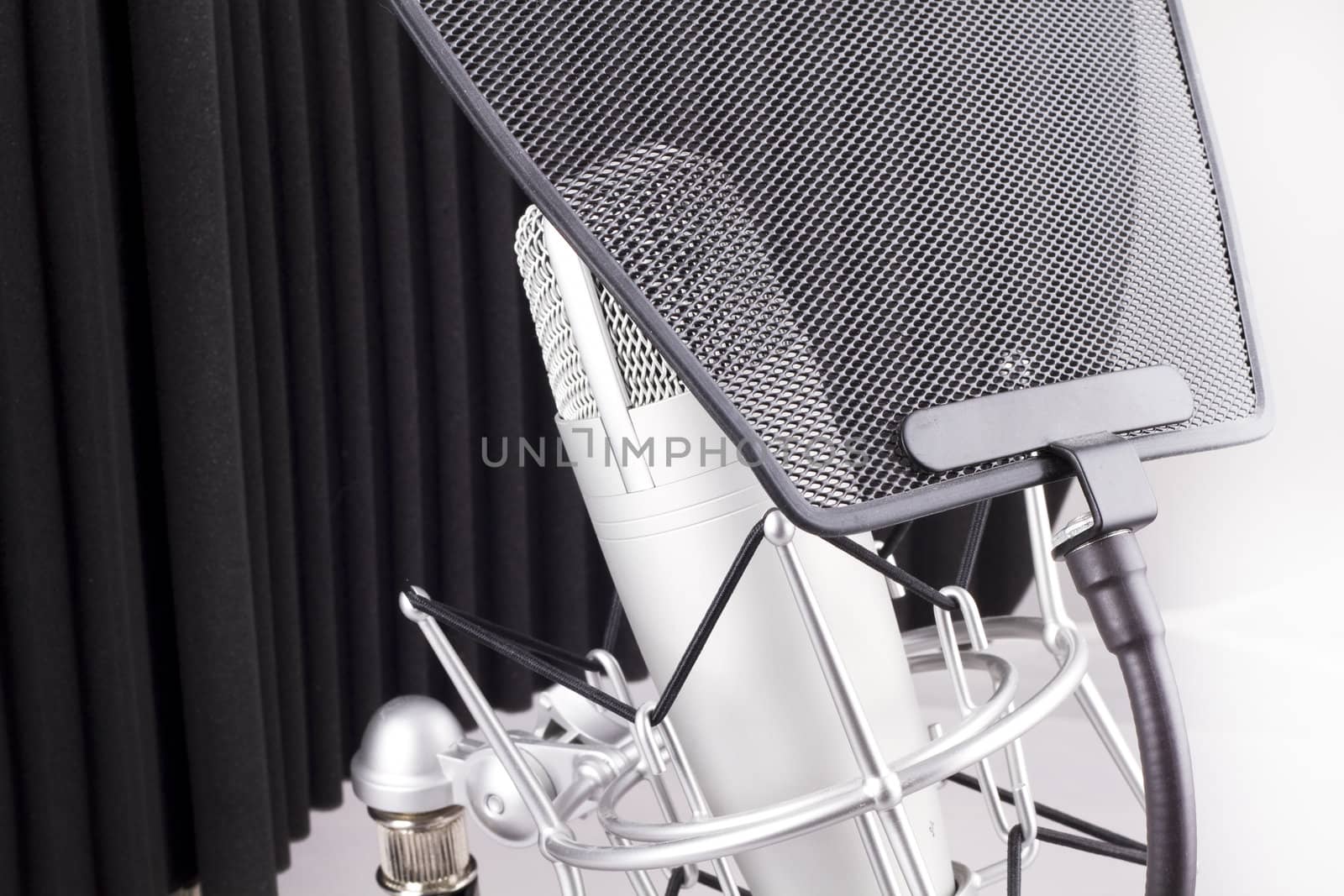 Professional studio microphone on white background by FernandoCortes