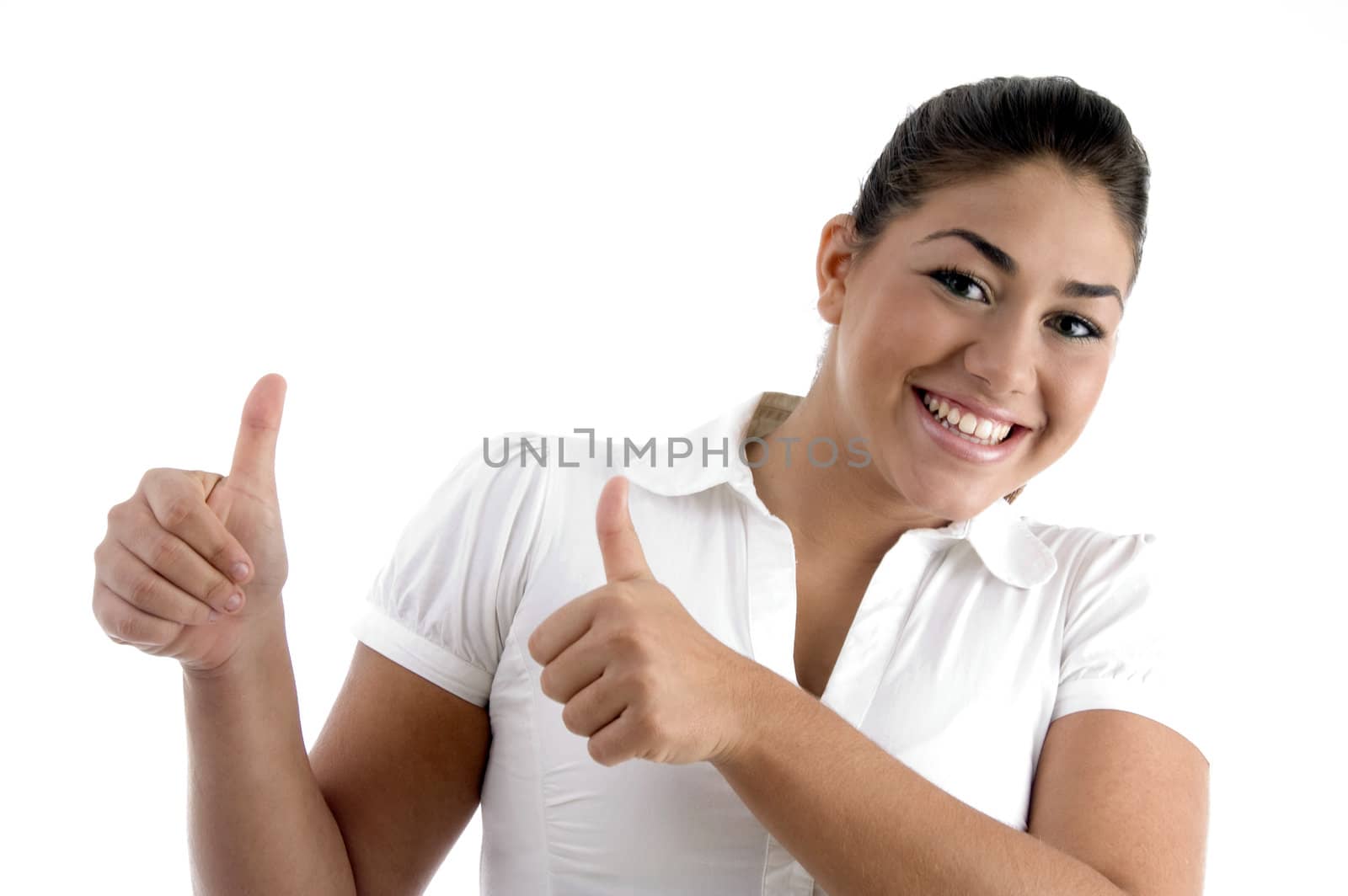 smiling woman showing good luck gesture against white background