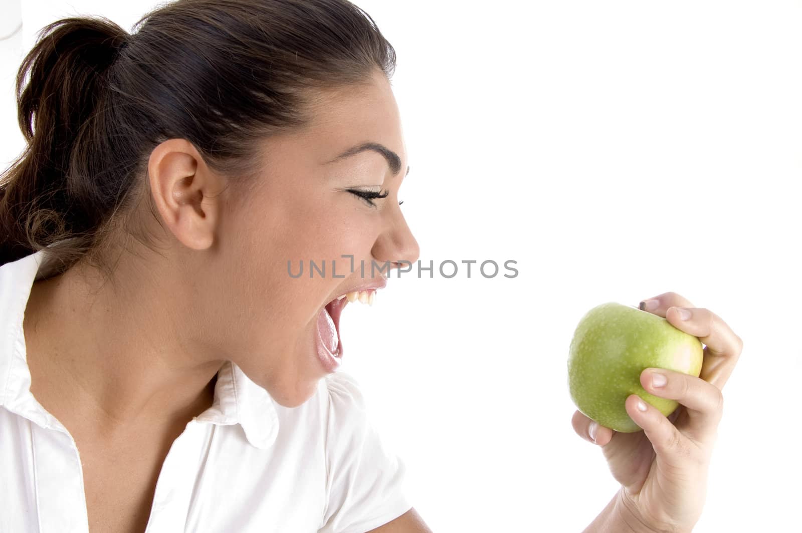 young model going to eat fresh apple on an isolated background