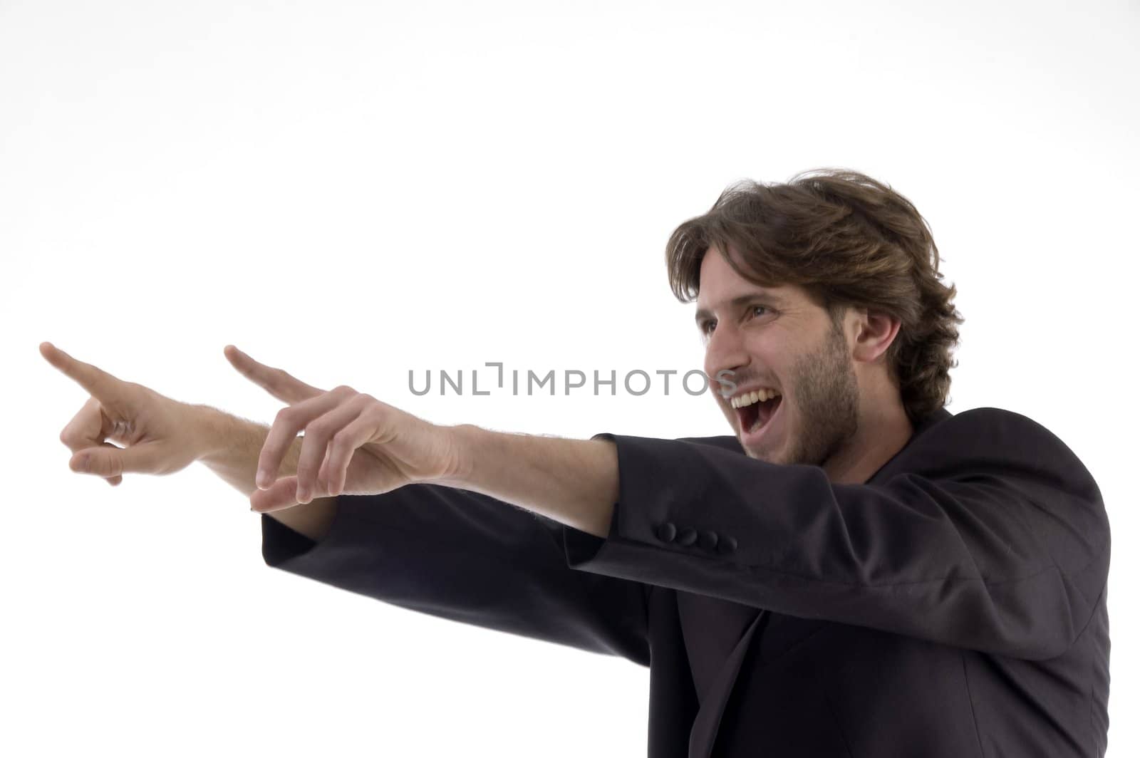 shouting young man pointing sideways against white background