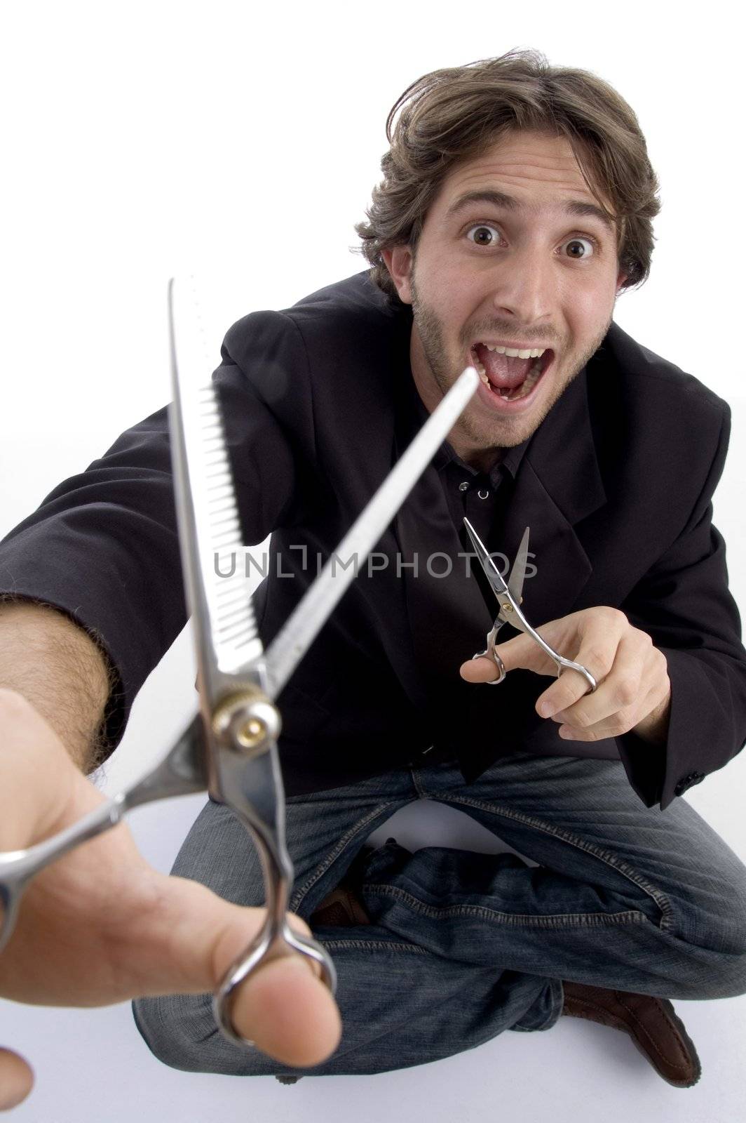 young barber with scissors against white background
