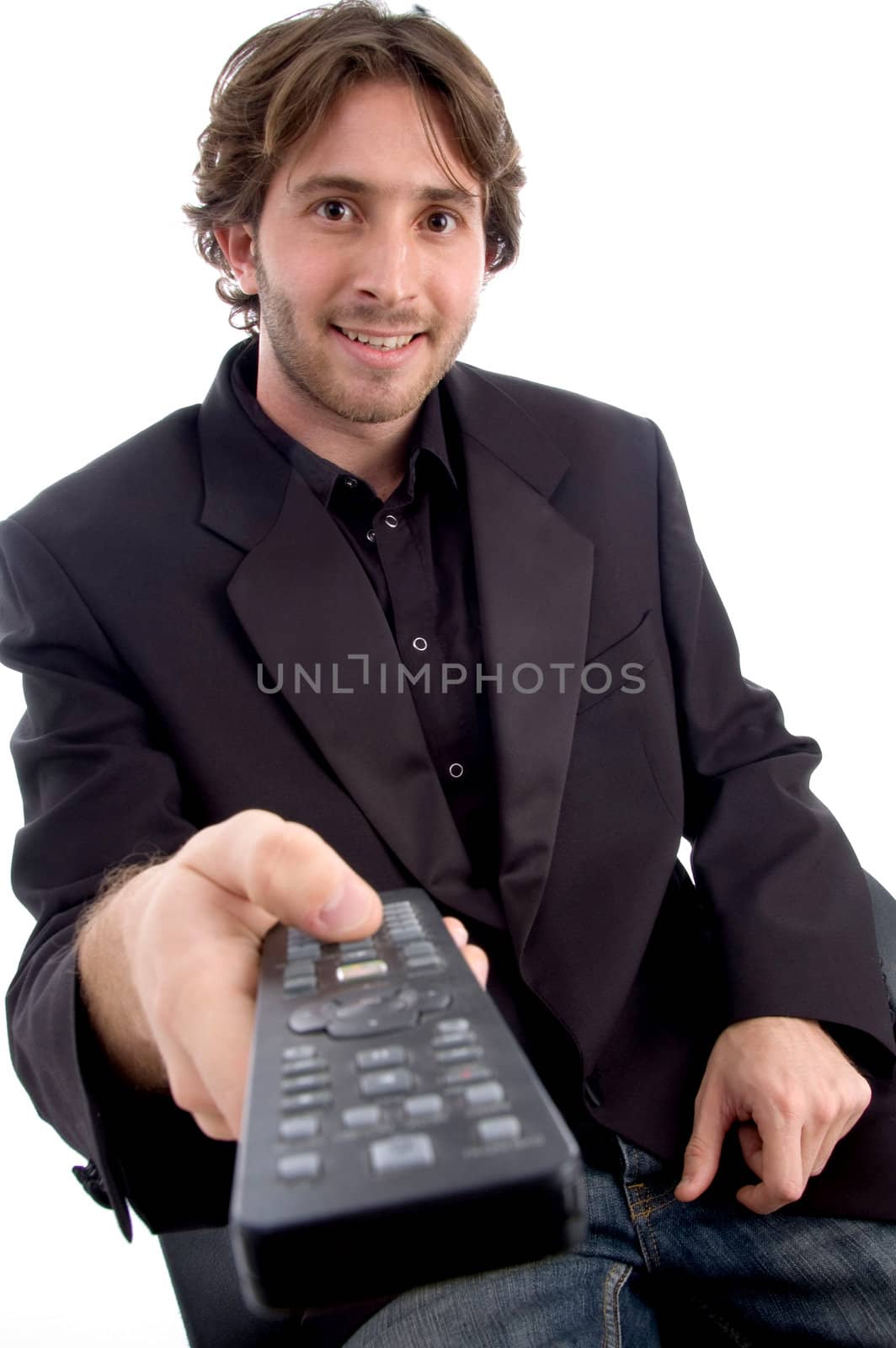 young businessman with remote control against white background