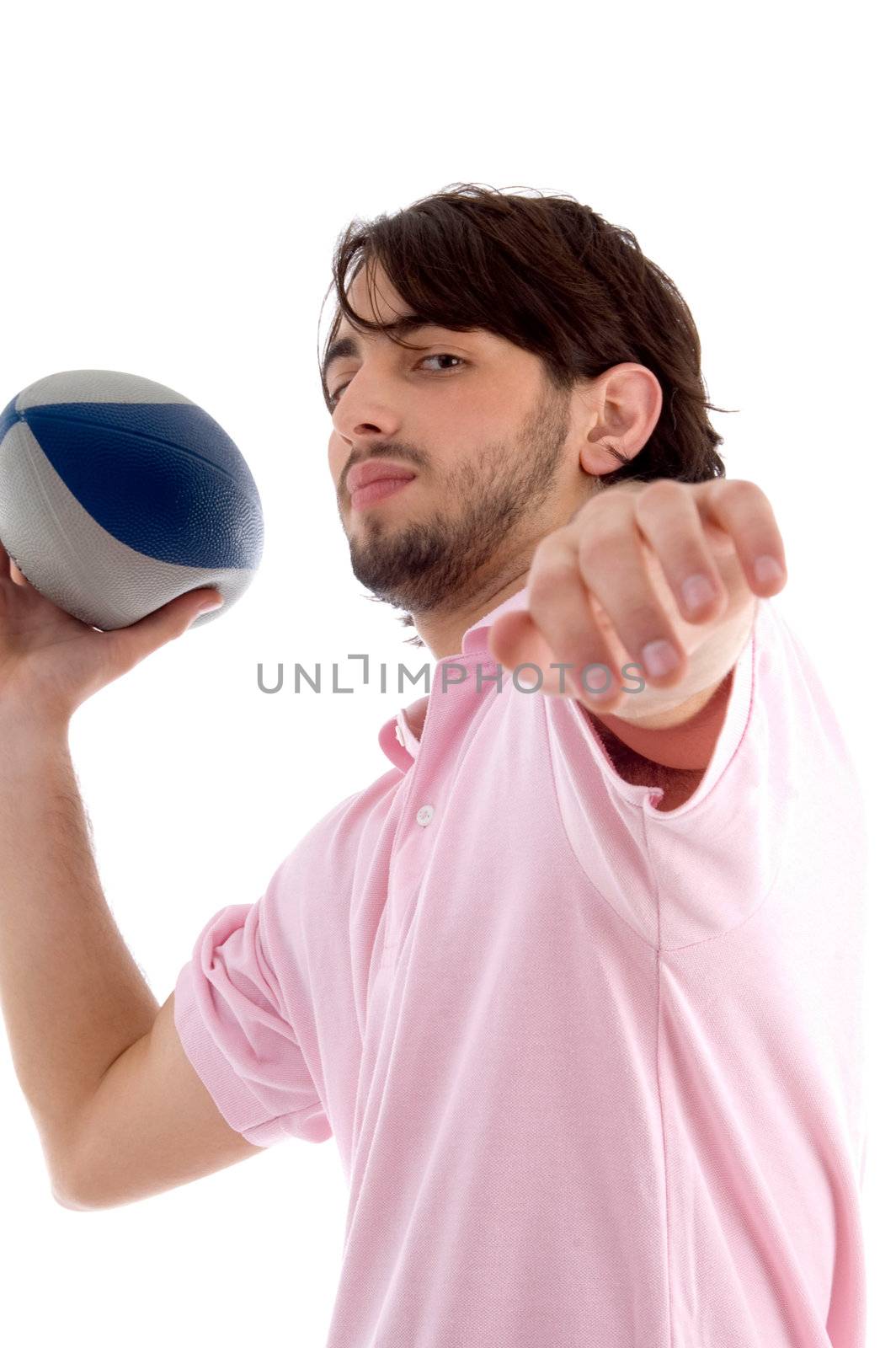 side pose of man with rugby ball on an isolated white background