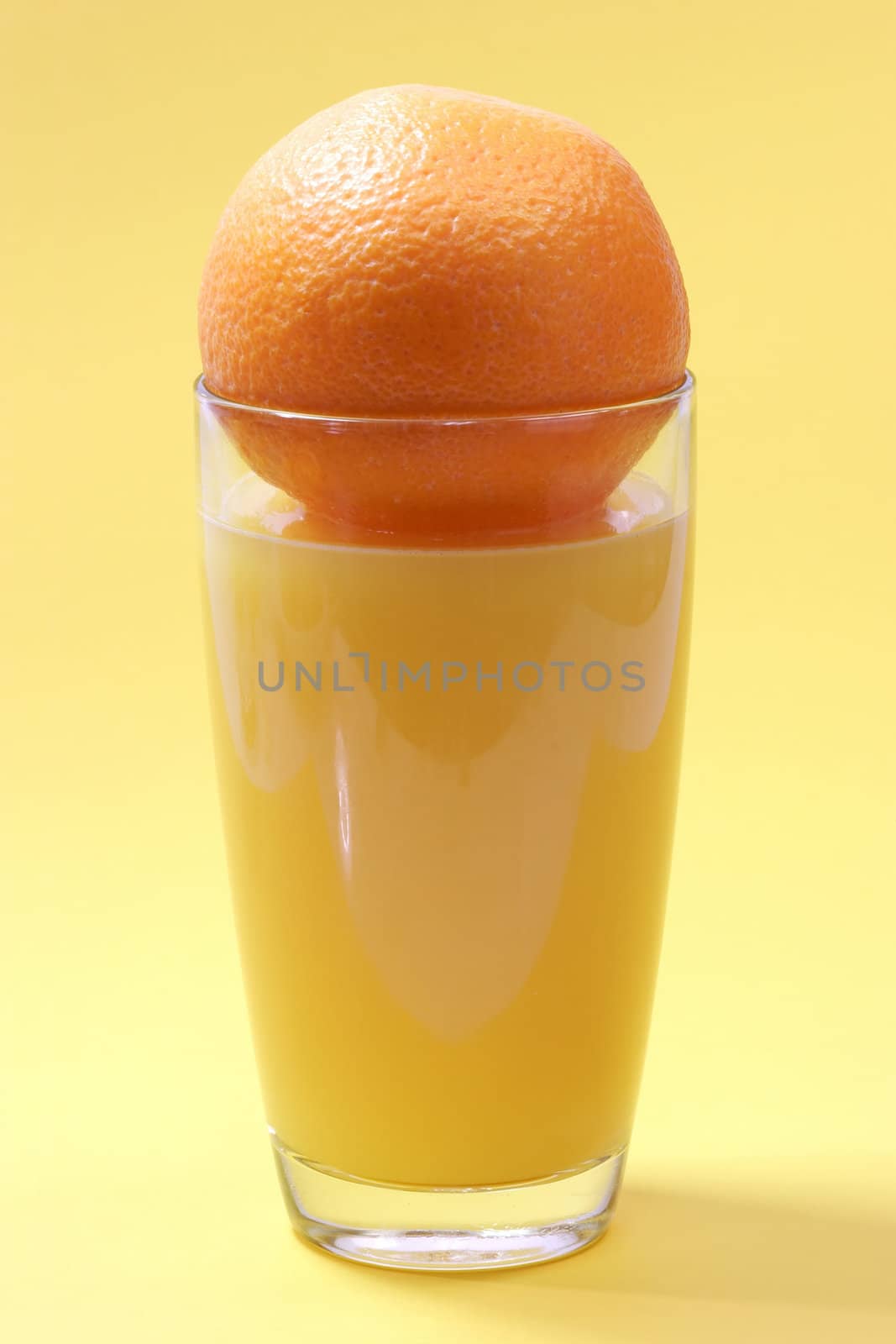 Orange juice on bright background