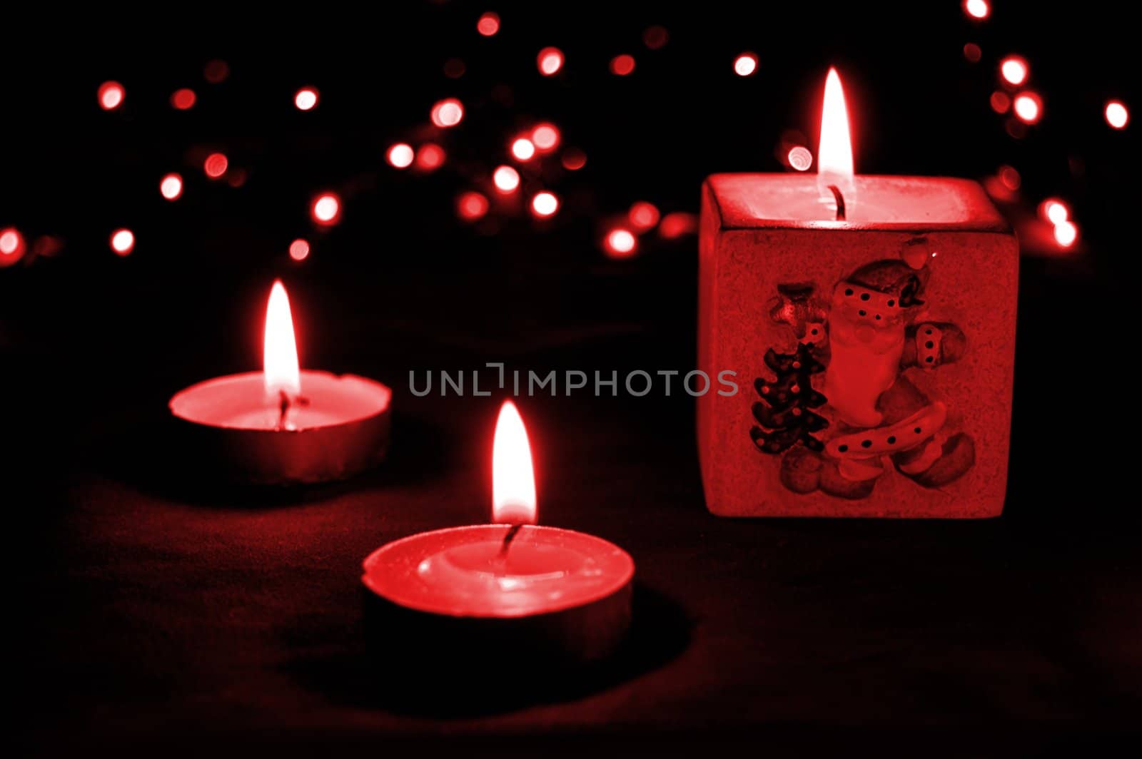 Christmas candle light in red tones