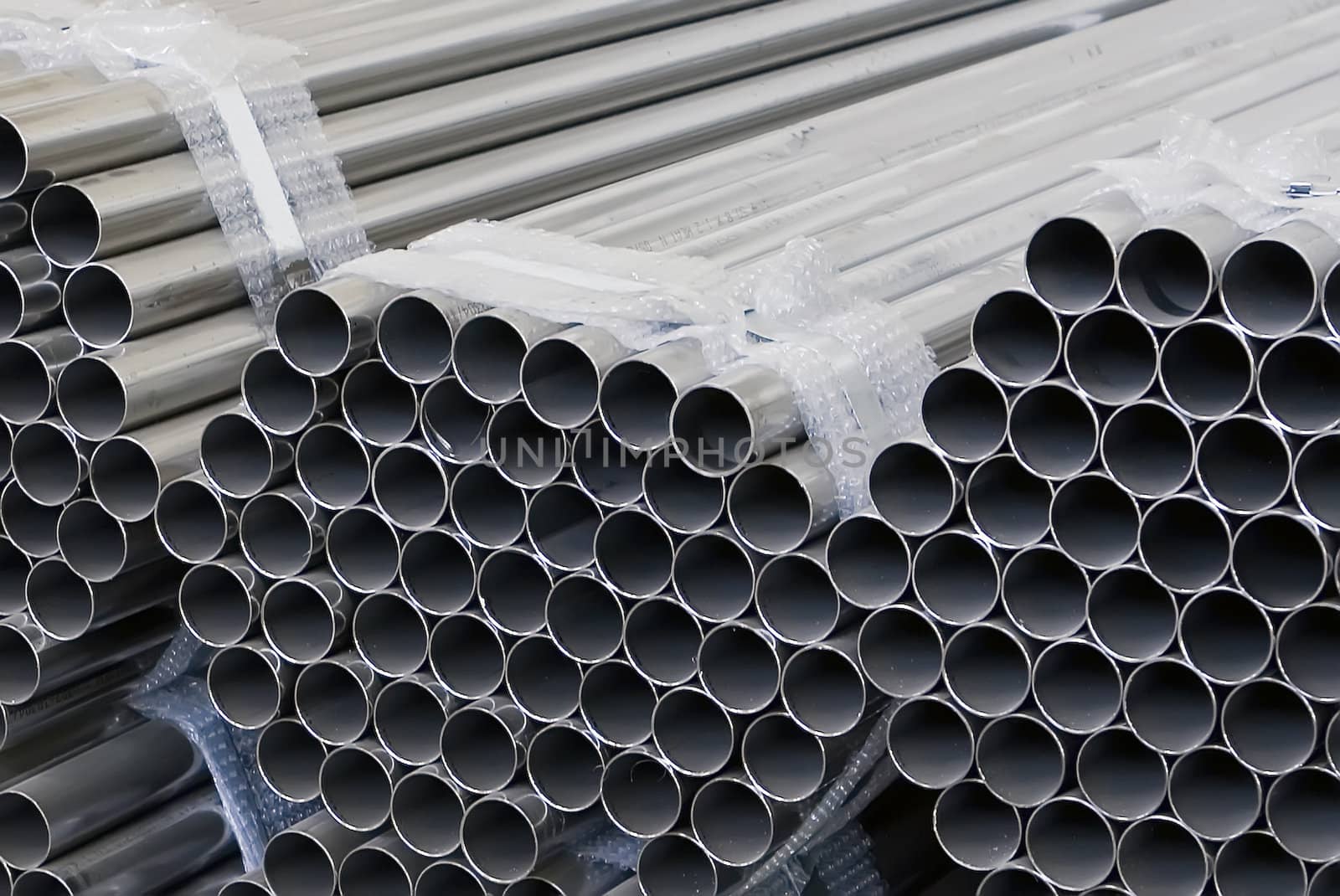 Bunches of round stainless steel pipes