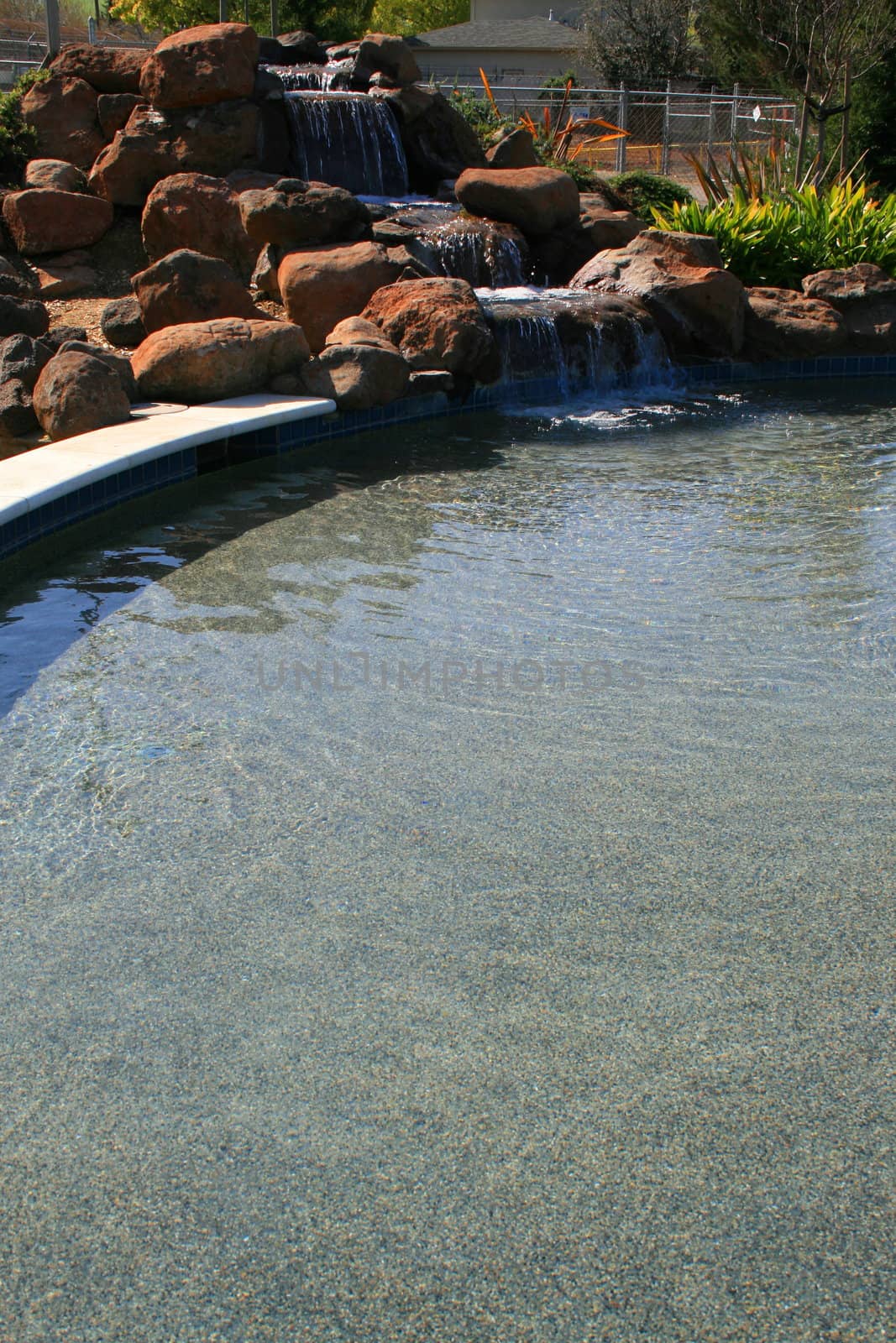 Close up of a waterfall in a garden.
