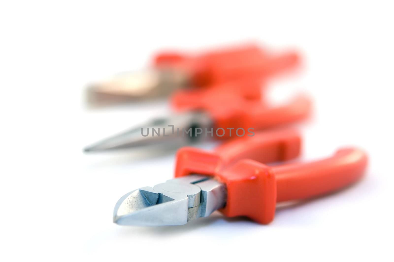 Pliers with red handles on white background