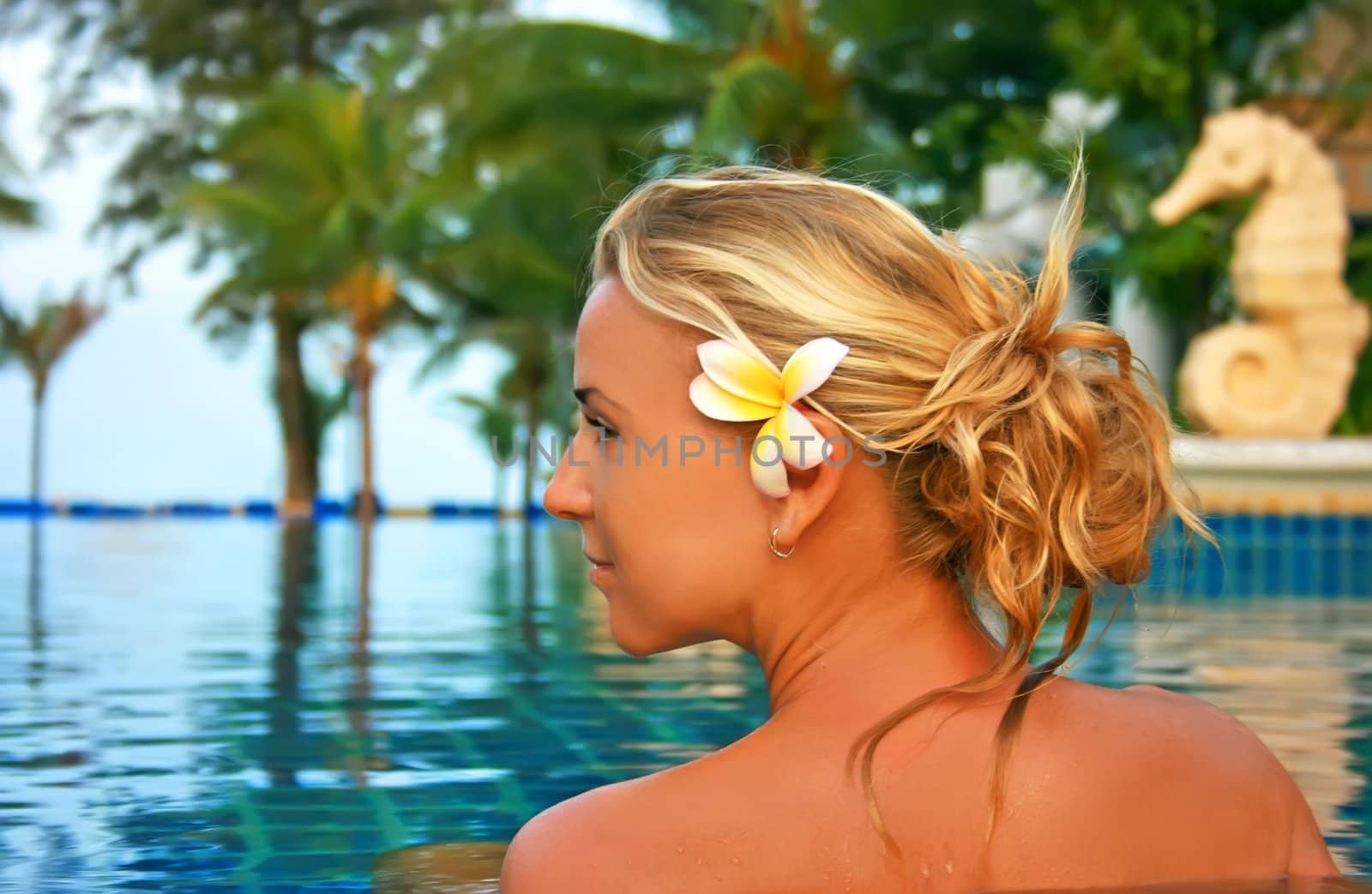 Pretty girl in spa salon under open sky