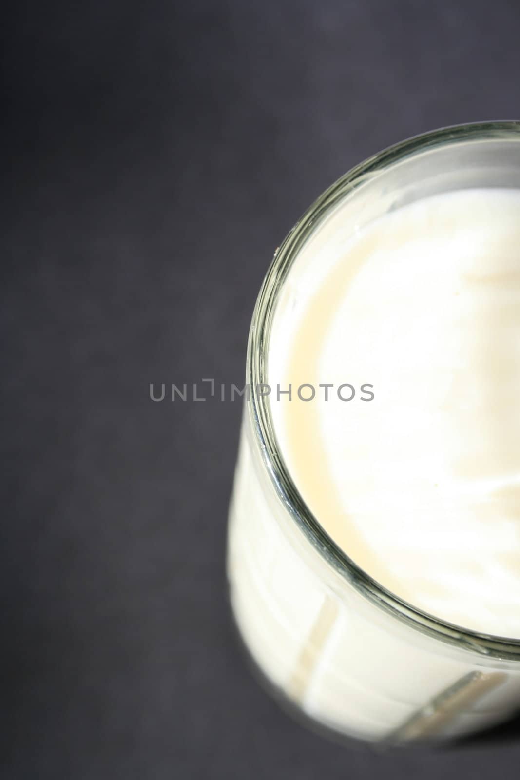 Close up of a glass of milk.
