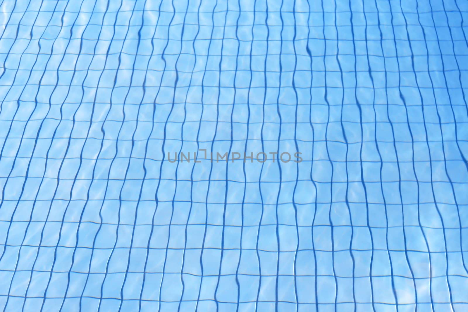 blue water texture at pool with grid sandstone