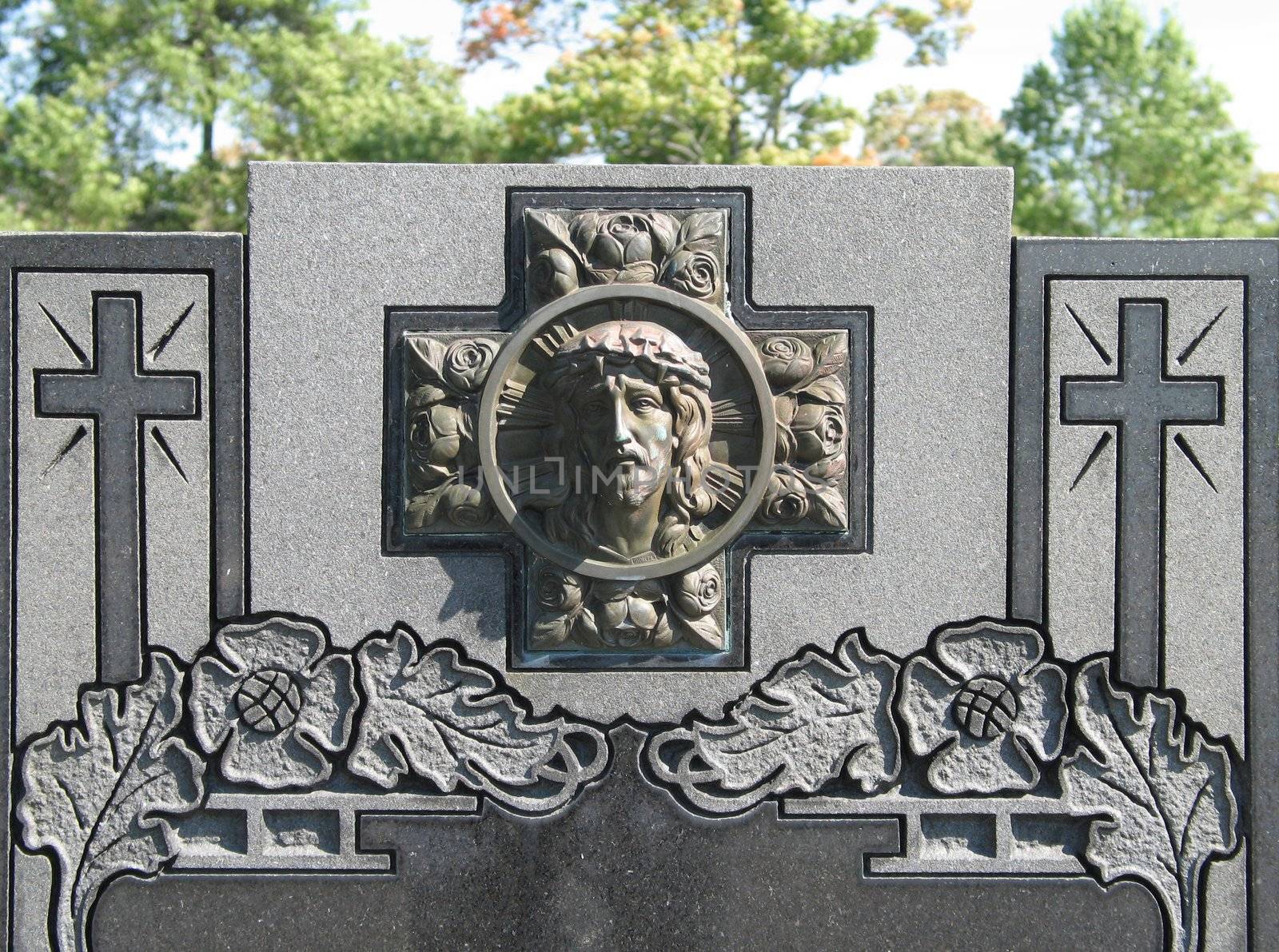 stone tomb with carved jesus