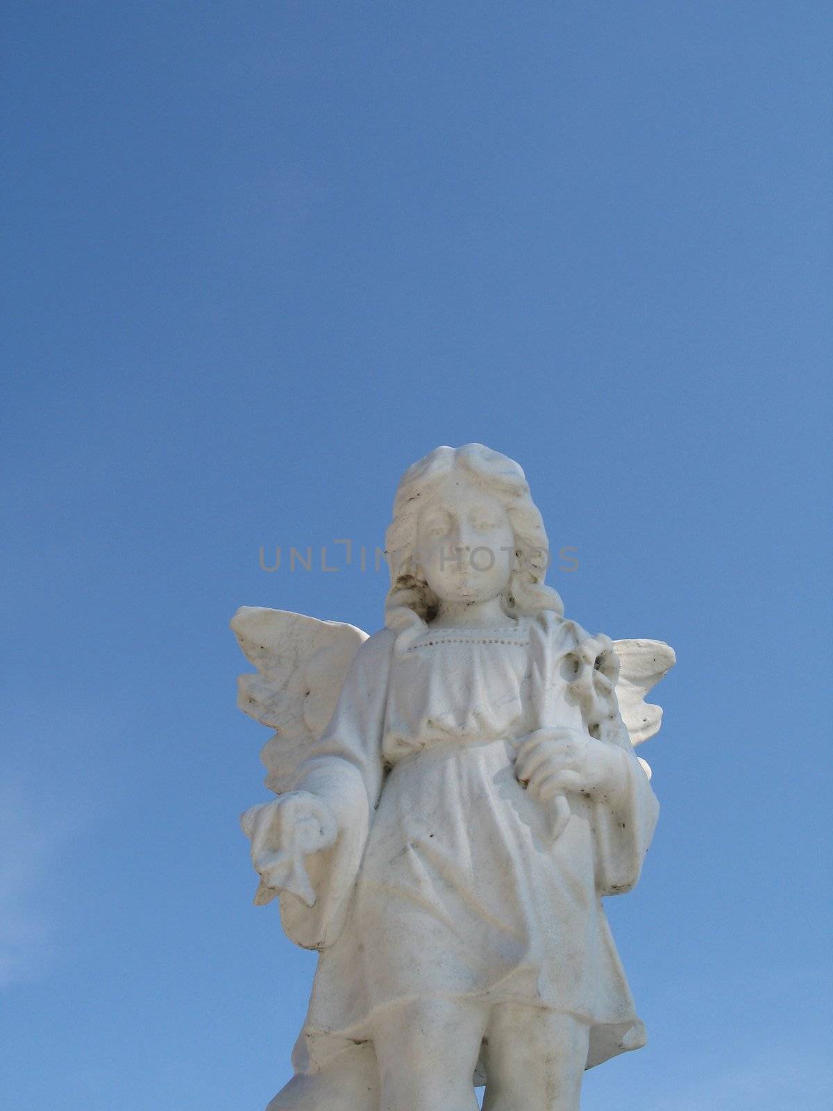 stone angel and blue sky
