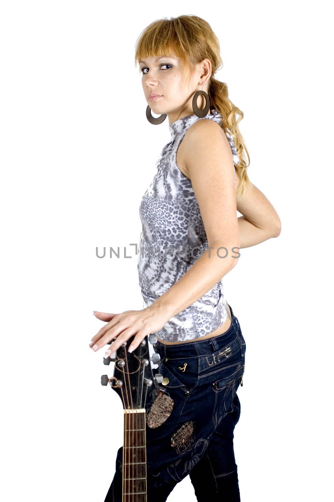 Musician portrait. Pretty, blonde girl holding top of her guitar, serious face expression. 