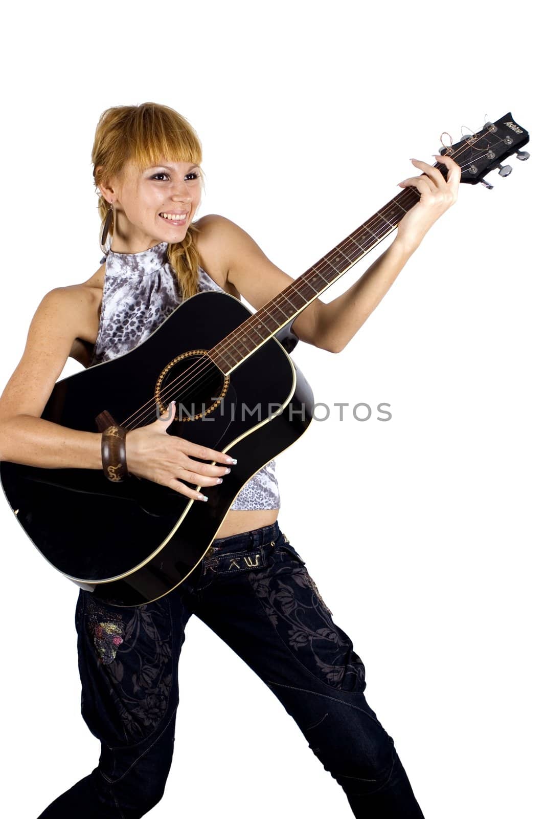 Pretty, blonde girl holding guitar, happy, laughing and playing music.