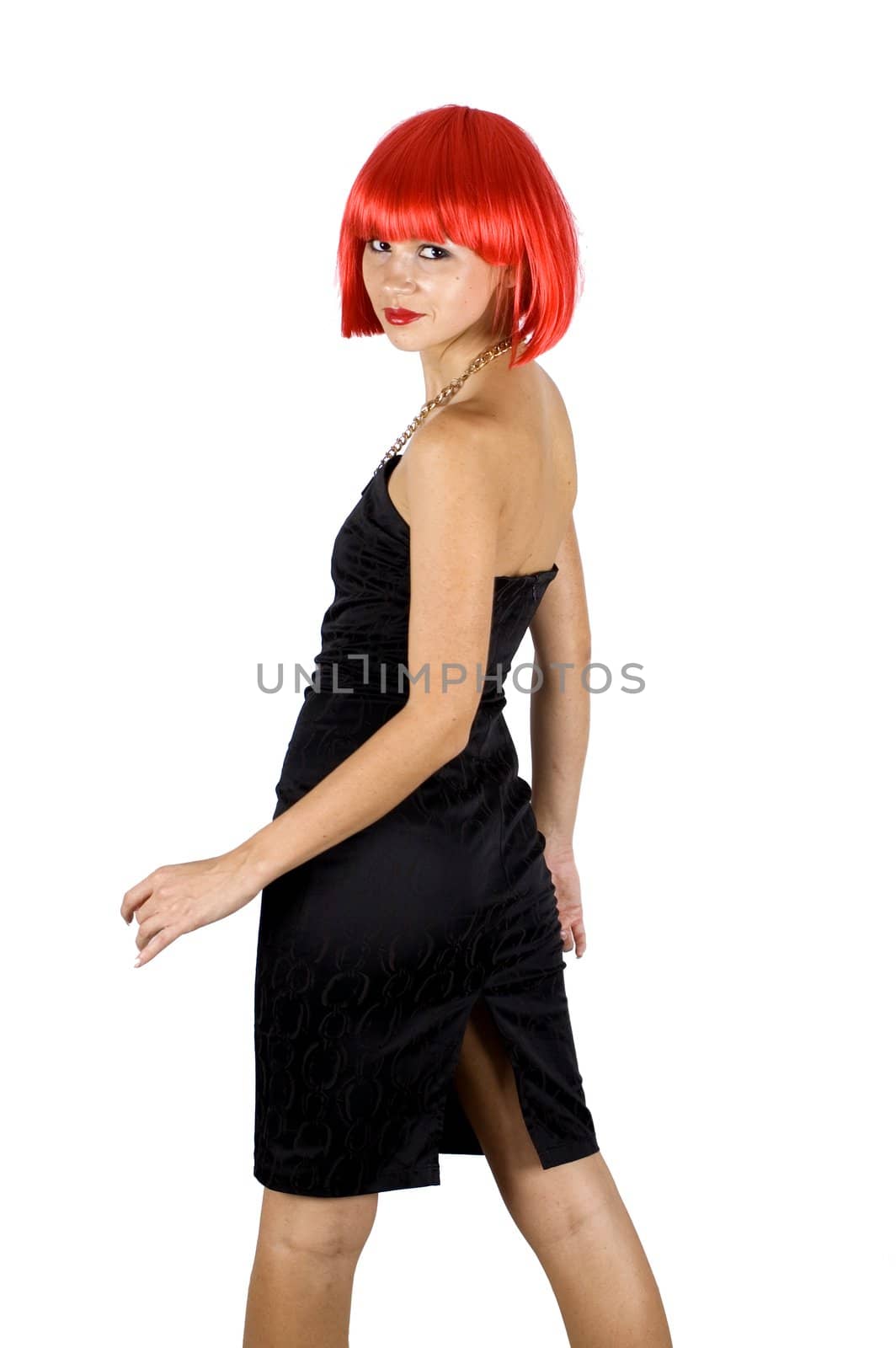 Red hair girl, turning her face for photo. Young, pretty female model. Naughty behaviour, wearing black skirt.