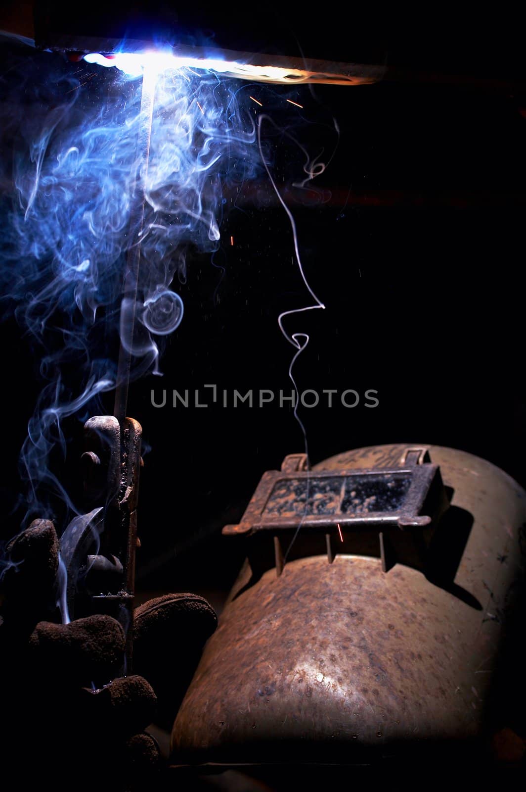 a picture of a welder working at night