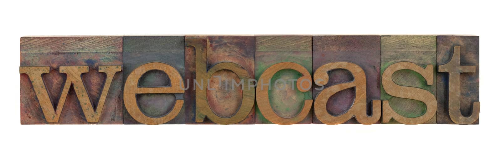 the word webcast in vintage letterpress type blocks, stained by color inks, isolated on white