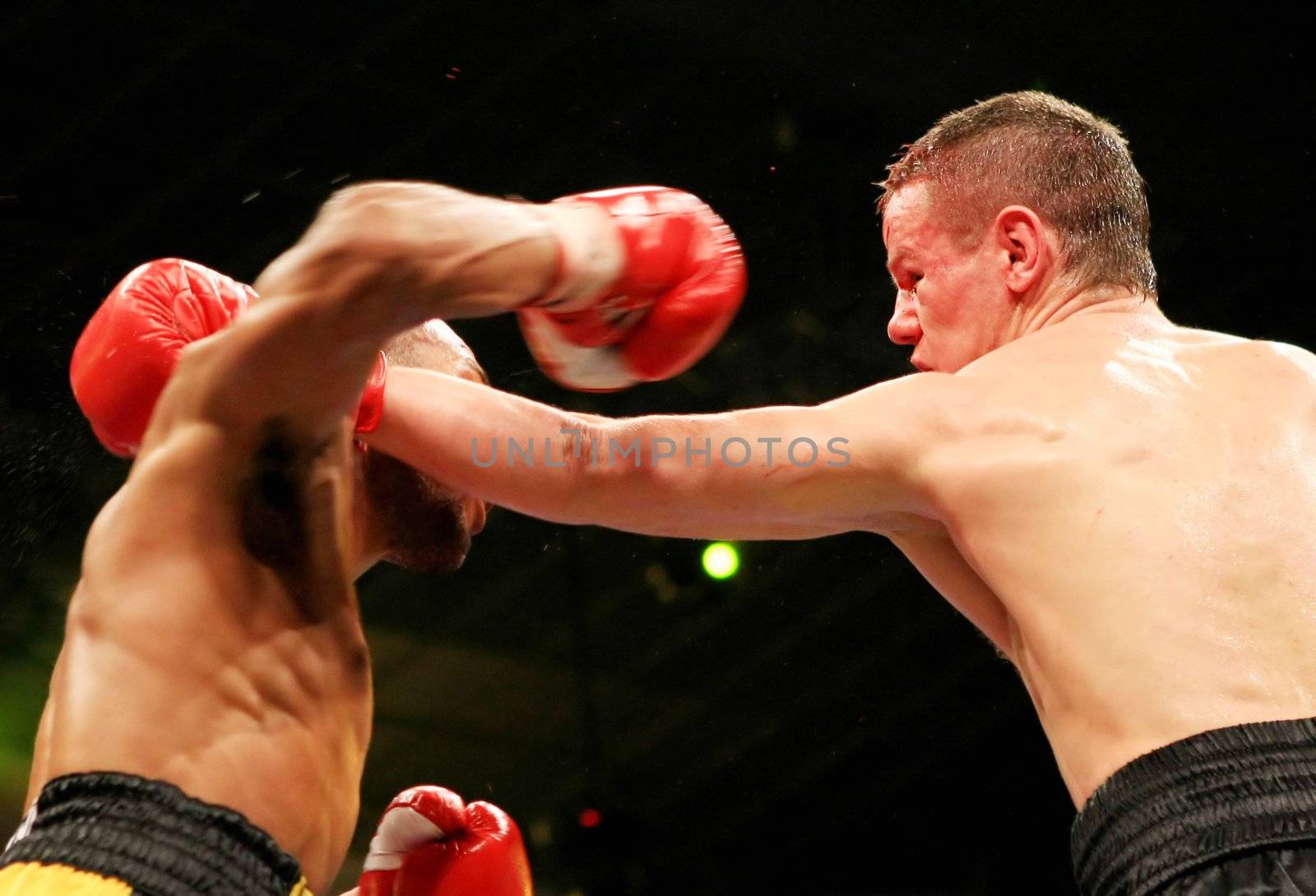 WBA interim welterweight belt holder Yuriy Nuzhnenko of Ukraine (R) throws a punch against Irving Garcia of Puerto Rico (WBA ranked #15) during their WBA World Welterweight Title fight in Kyiv, Saturday, April 19, 2008. The bout ended in a technical draw and Nuzhnenko retained his title.