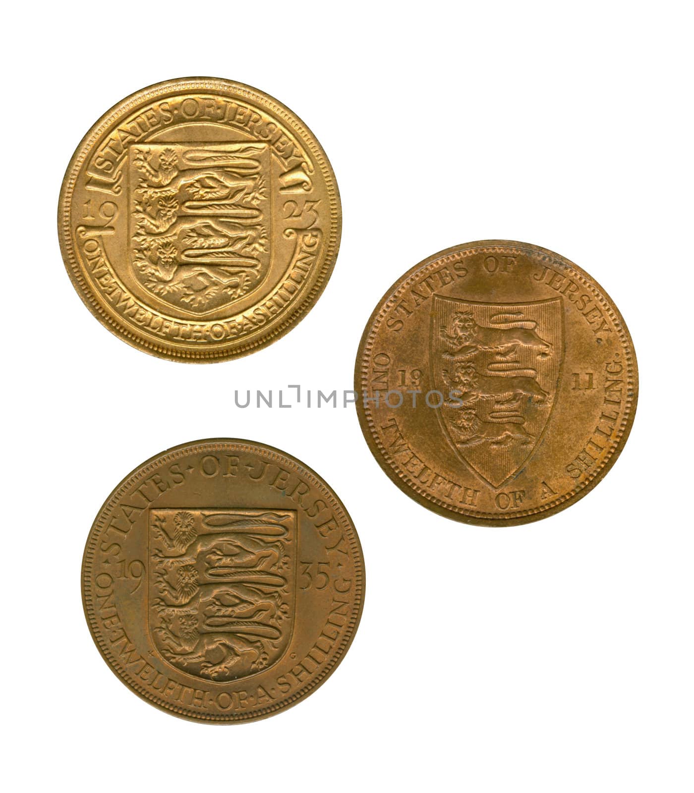 Three gold jersey coins of one twelfth of a shilling on white background