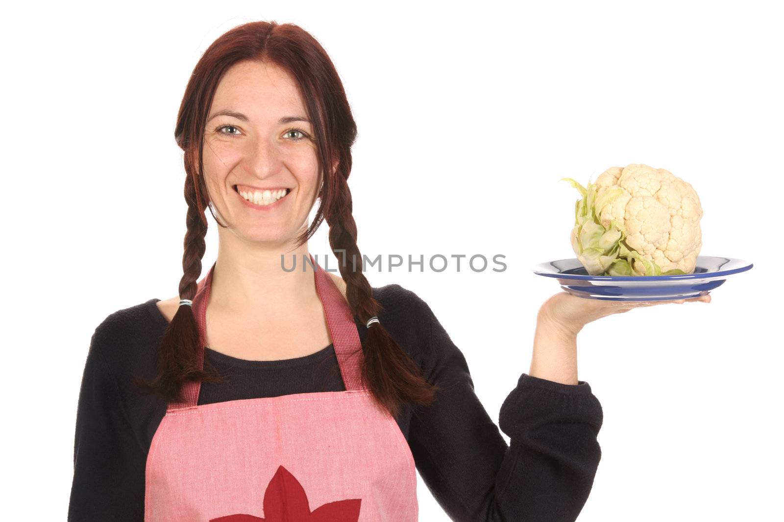 beautiful housewife holding plate with cauliflower