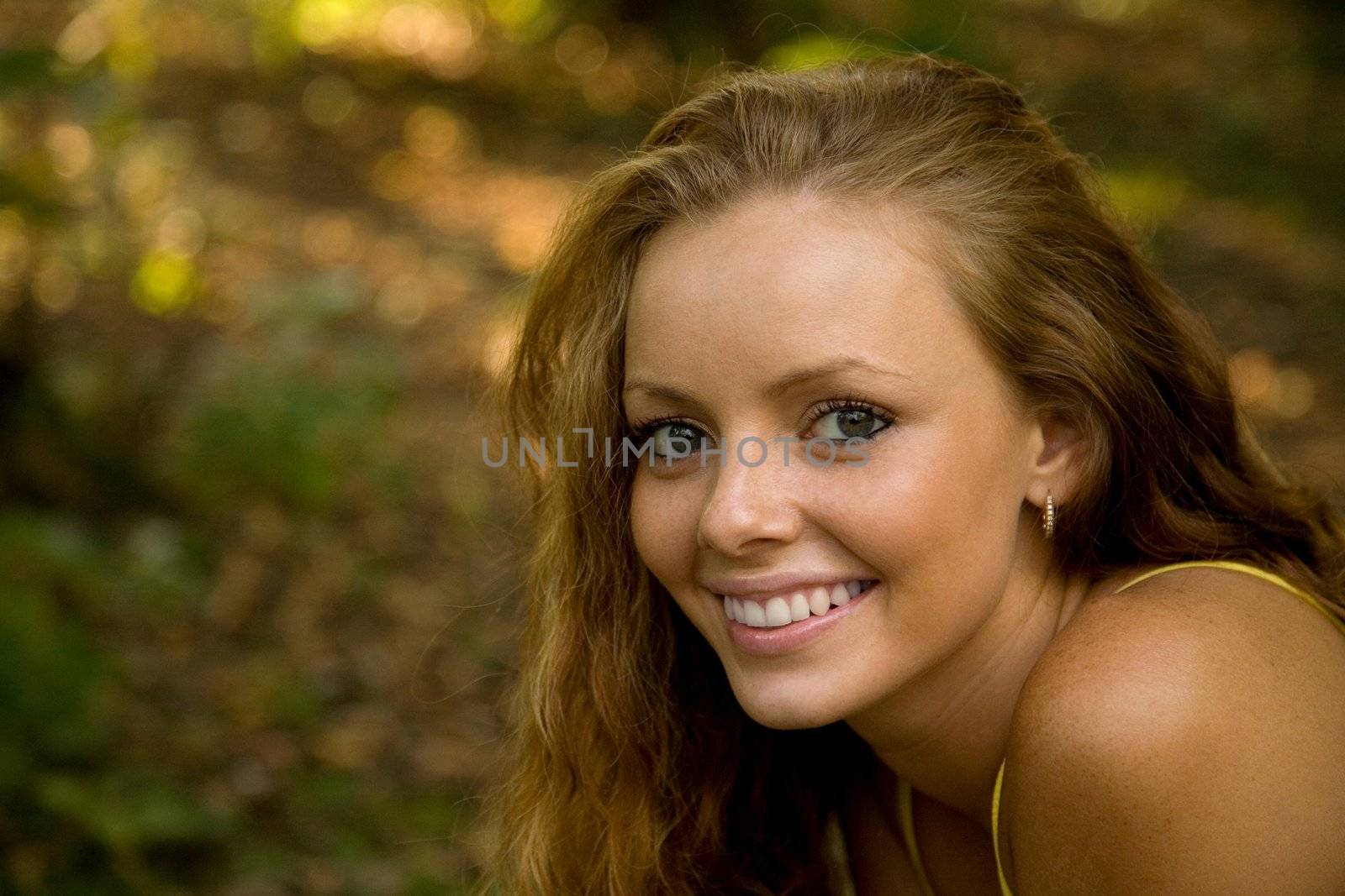 portrait of a redheaded girl in autumn 