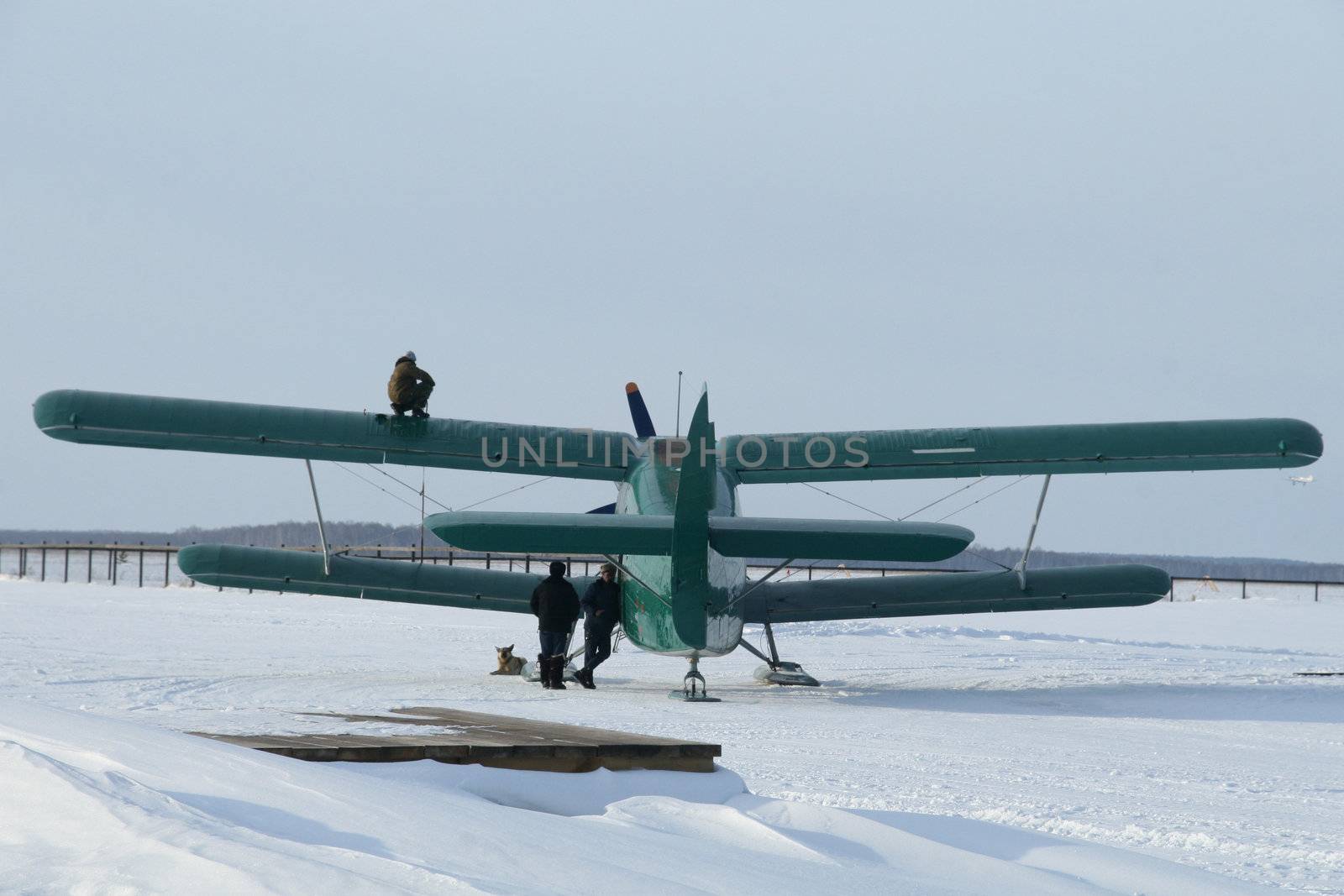 plane with skis on the snow by skutin