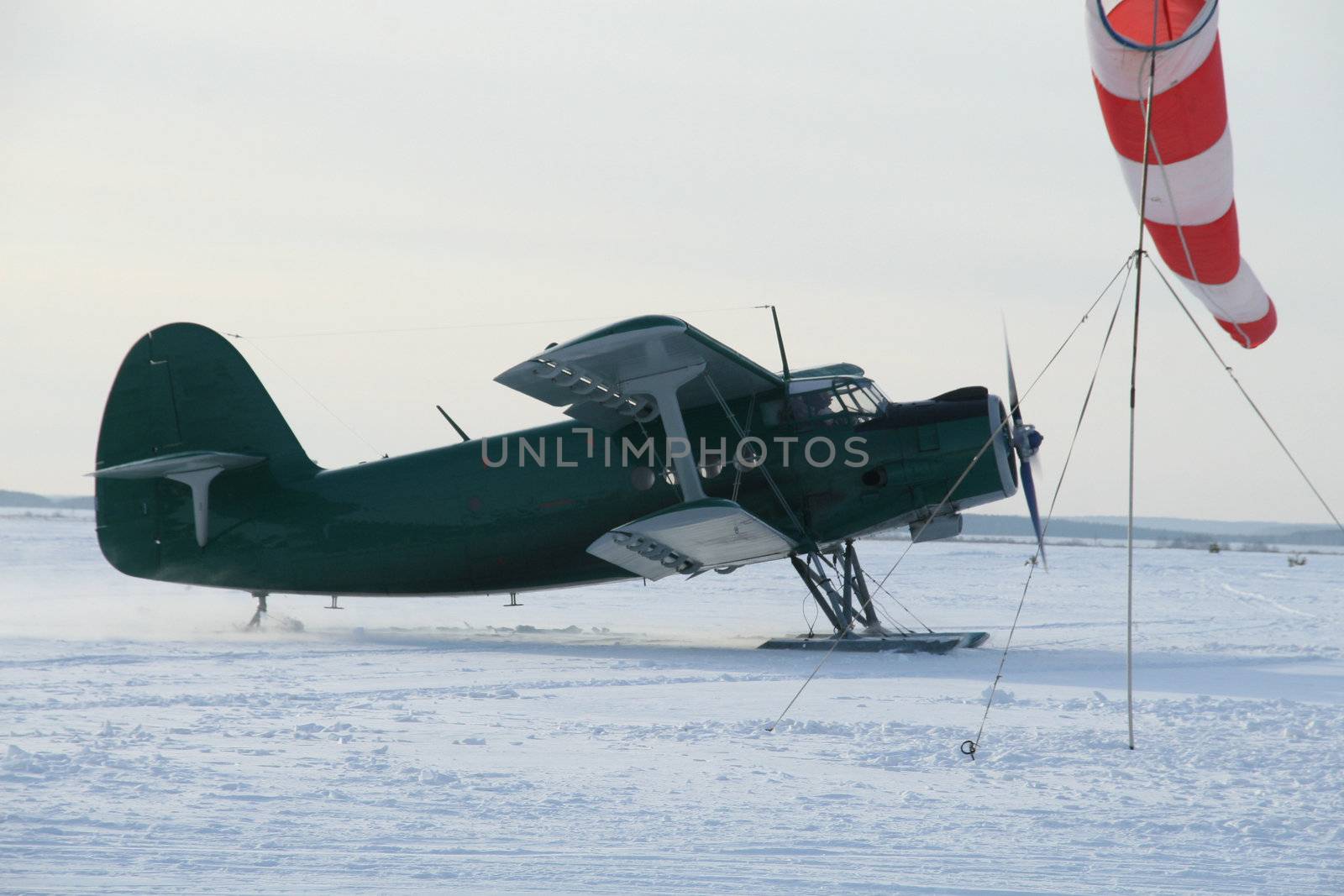 plane with skis on the snow by skutin