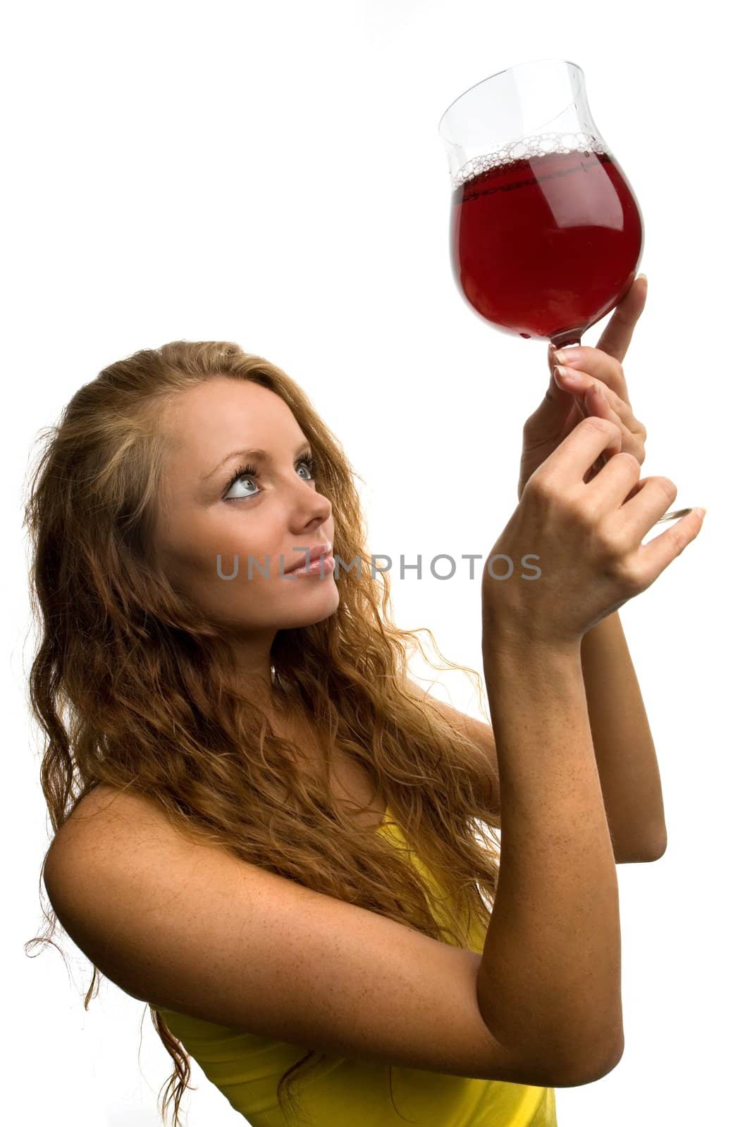 beautiful girl with a glass of wine on a light background